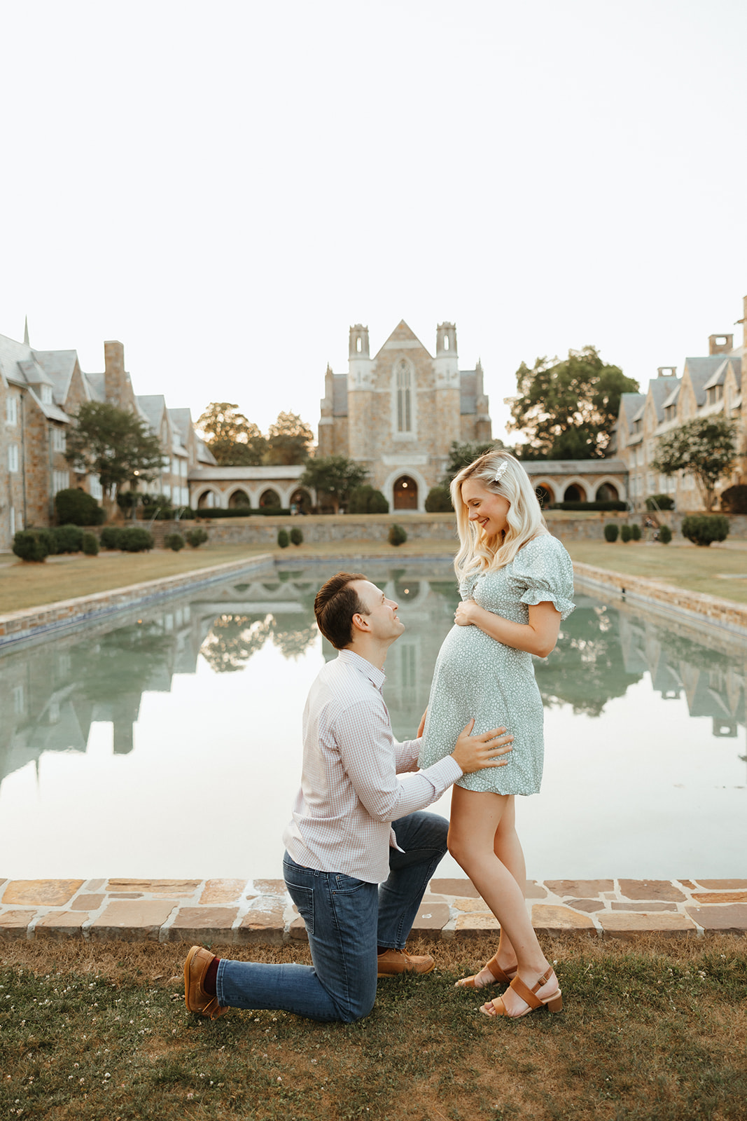 A couple taking maternity photos at Berry College in Rome, GA