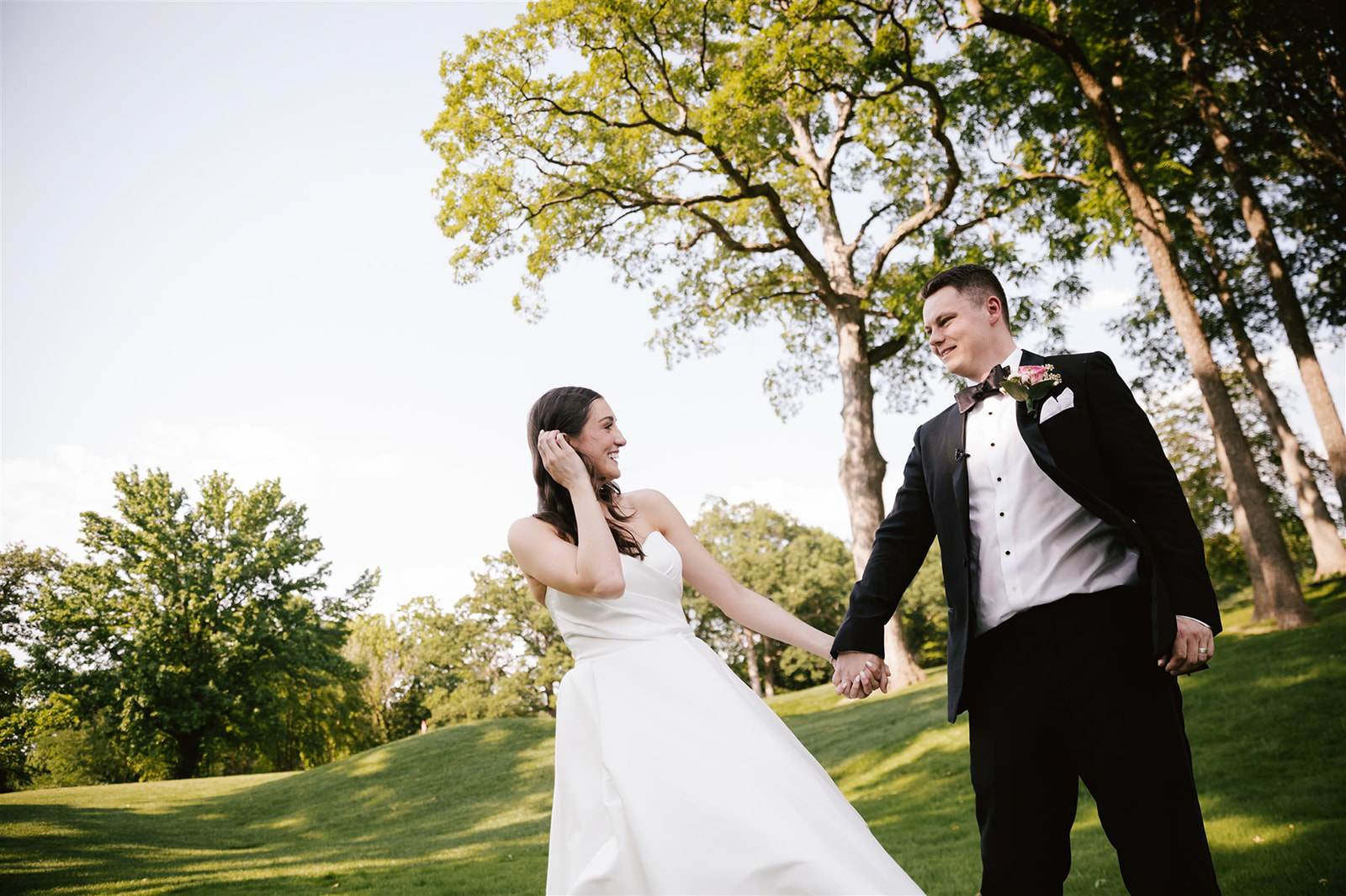 Candid portraits capturing the genuine emotions and joyful moments of the bride and groom in the warm glow of sunset.