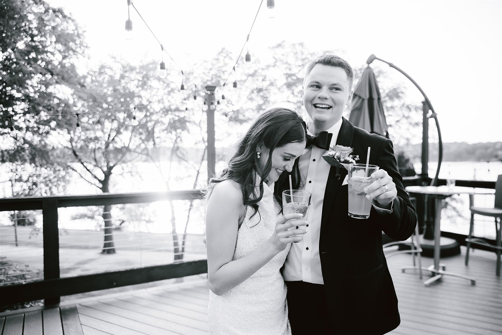 A captivating moment captured as the couple raises their glasses in a heartfelt toast against the backdrop of a stunning