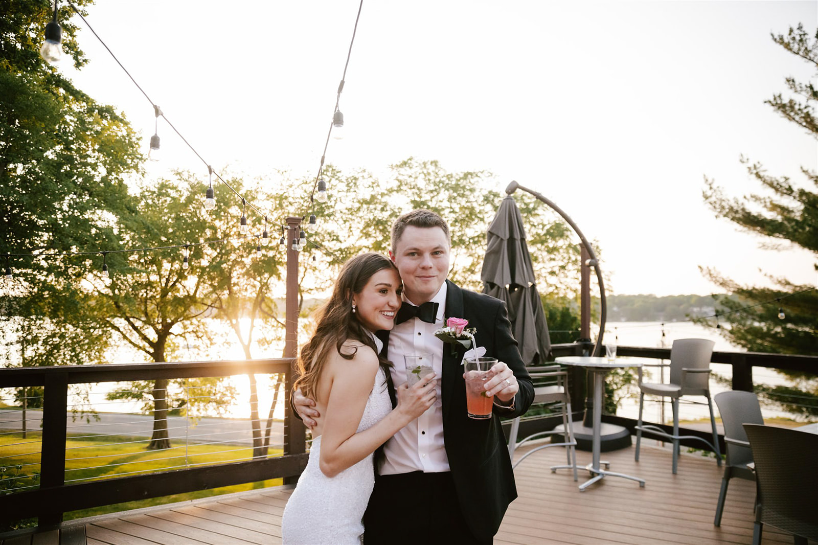 A captivating moment captured as the couple raises their glasses in a heartfelt toast against the backdrop of a stunning