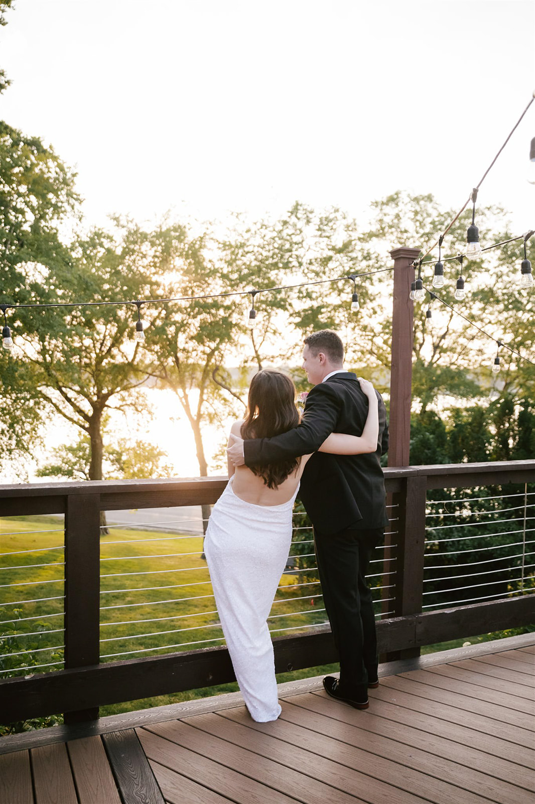 The breathtaking moment of the bride's dress change, illuminated by the golden hues of the sunset.