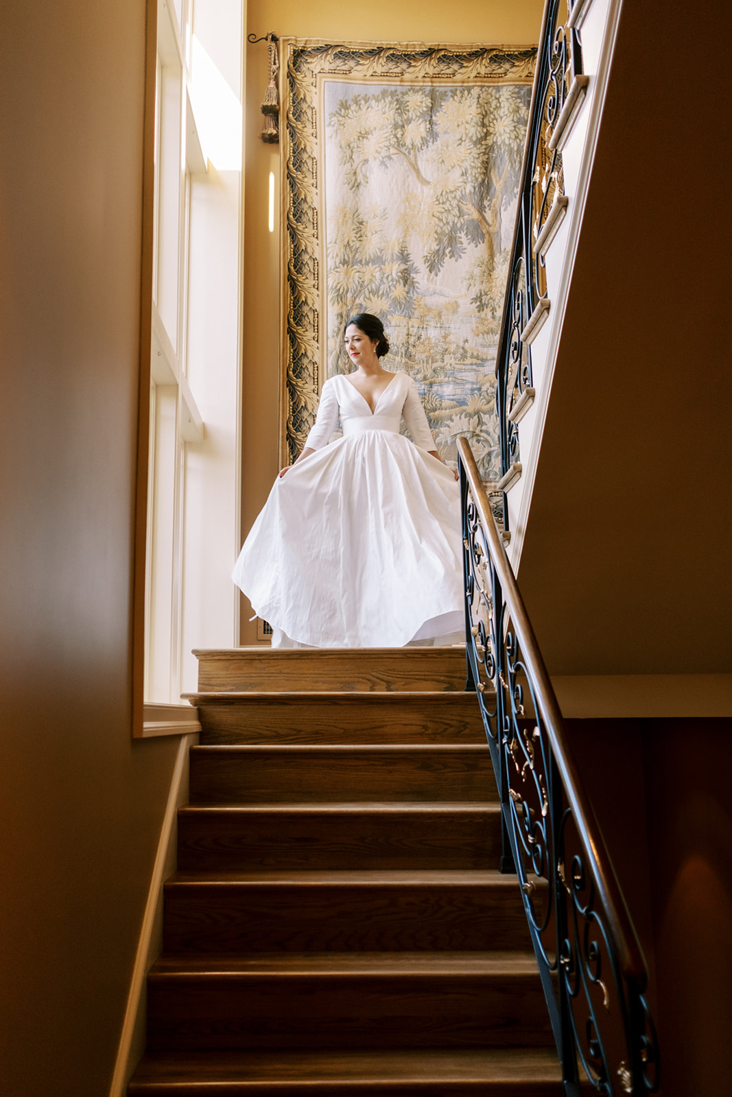 Elegant bride at the top of stairs in Maryland private residence backyard wedding