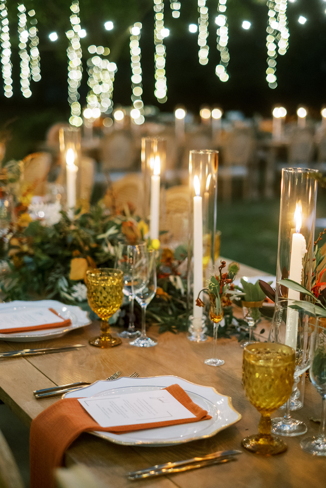 Table setting with backyard wedding string lights in Maryland