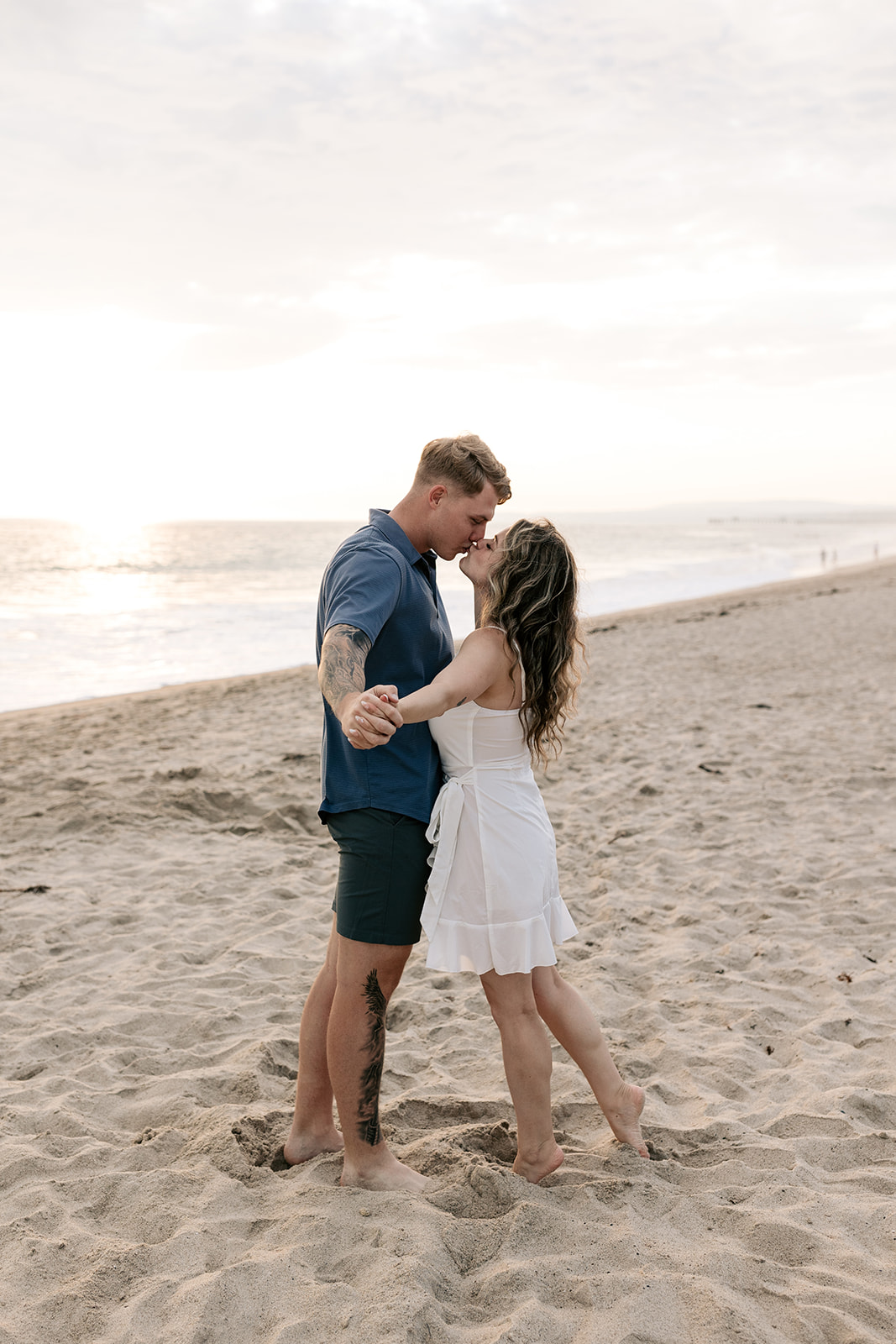 san clemente beach socal southern california engagement golden hour photos couple photography pastel skies white dress
