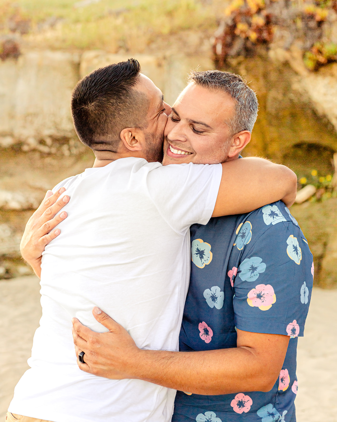 gay couple embracing beach santa cruz