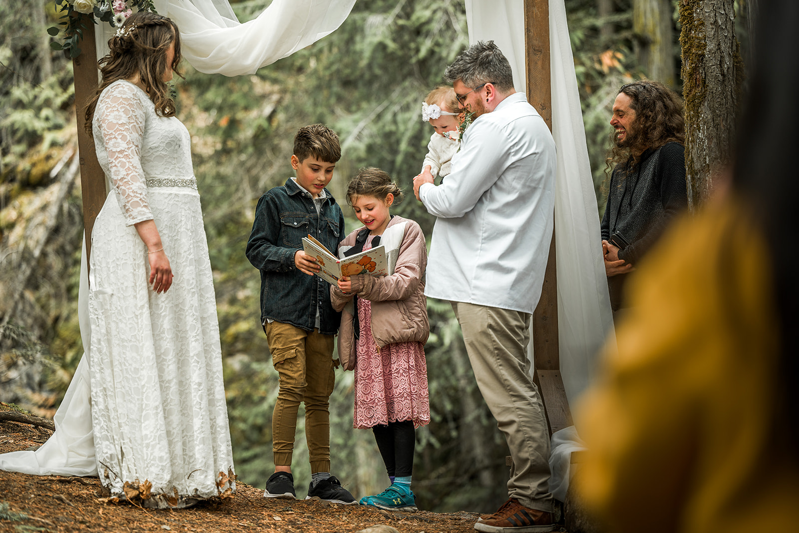 The bride and groom's children read a story about their parents