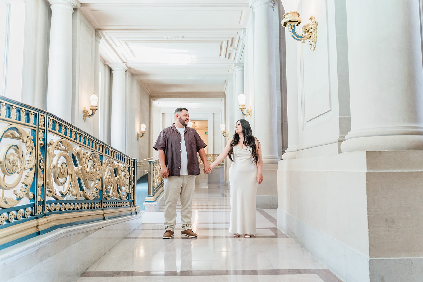 Couple standing in the hall at San Francisco City Hall