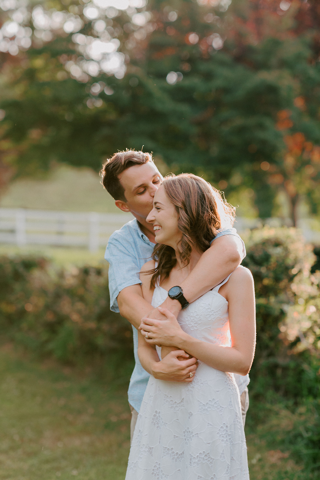 A couple cuddles during Virginia engagement session