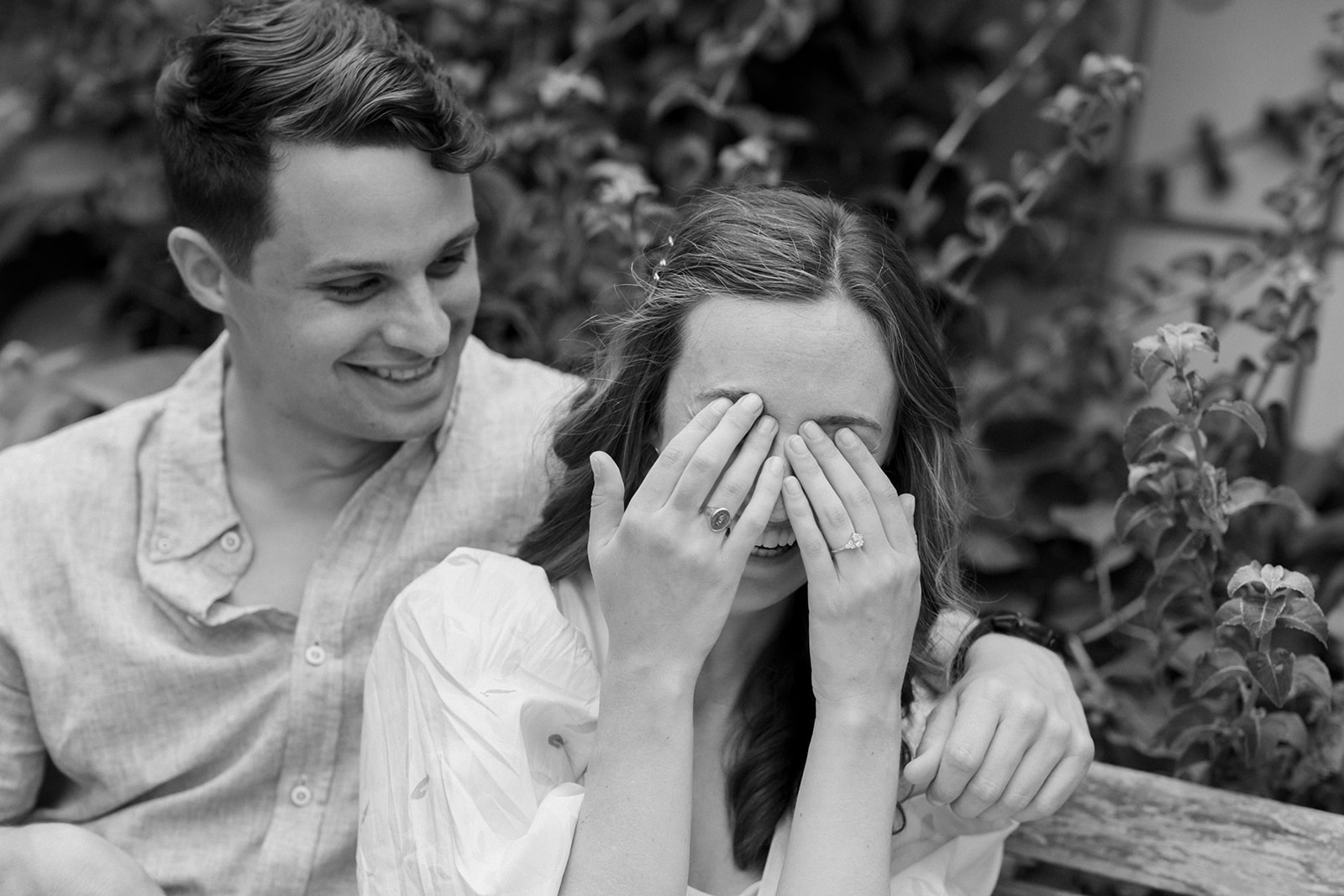 Girl covers eyes from laughing hard in Virginia engagement session