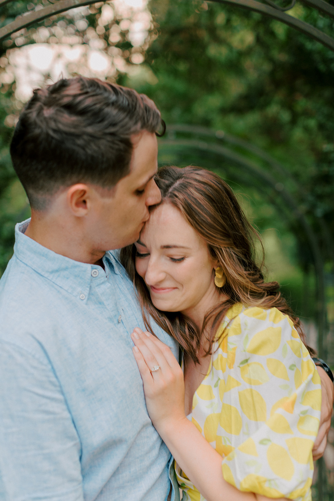 Guy kisses fiance on the forehead in Virginia engagement session