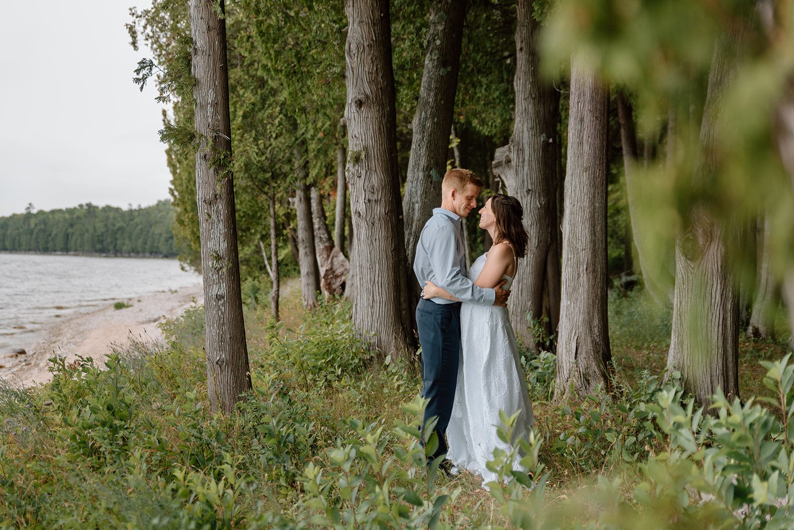 Exchanging private vows among the cedar trees on the shore of Lake Michigan at Bjorklunden in Baileys Harbor, WI