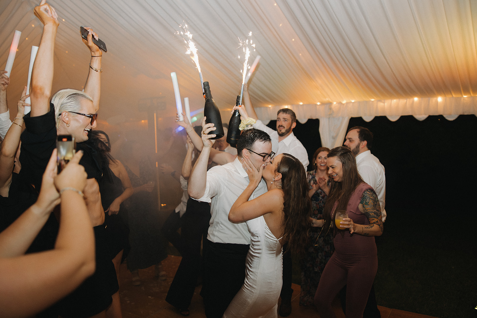couple dances during reception at outdoor wedding with tent