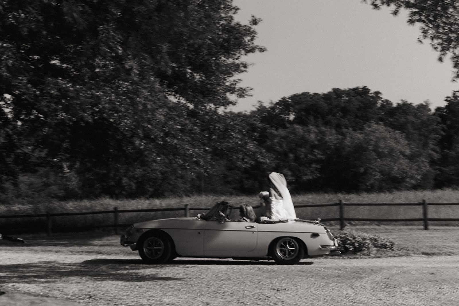 couple exits wedding ceremony in vintage car