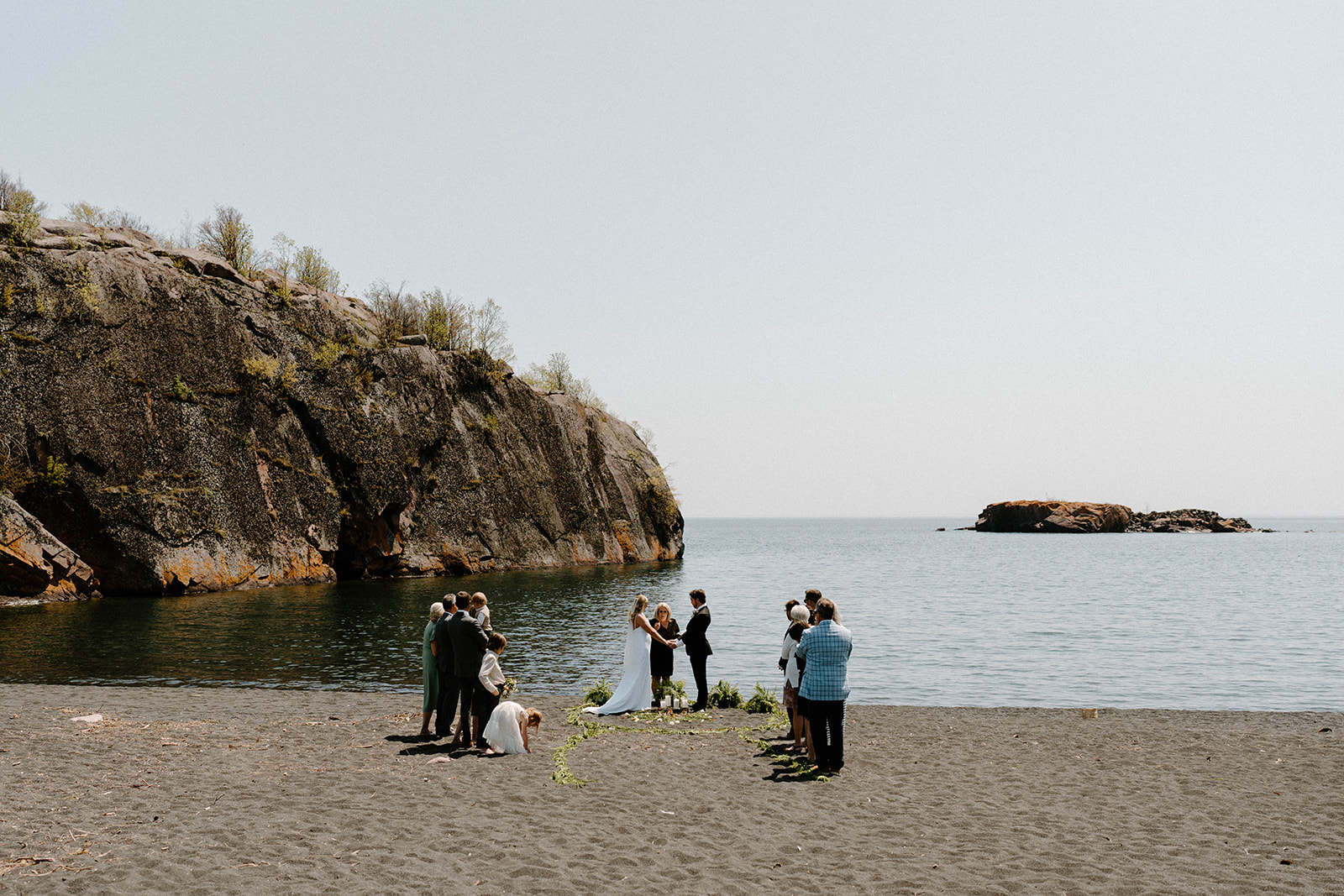 A couple who eloped at Black Beach, MN to say their vows in front of Lake Superior