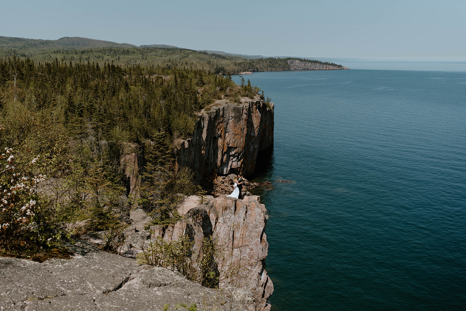 A couple who eloped at Black Beach, MN to say their vows in front of Lake Superior