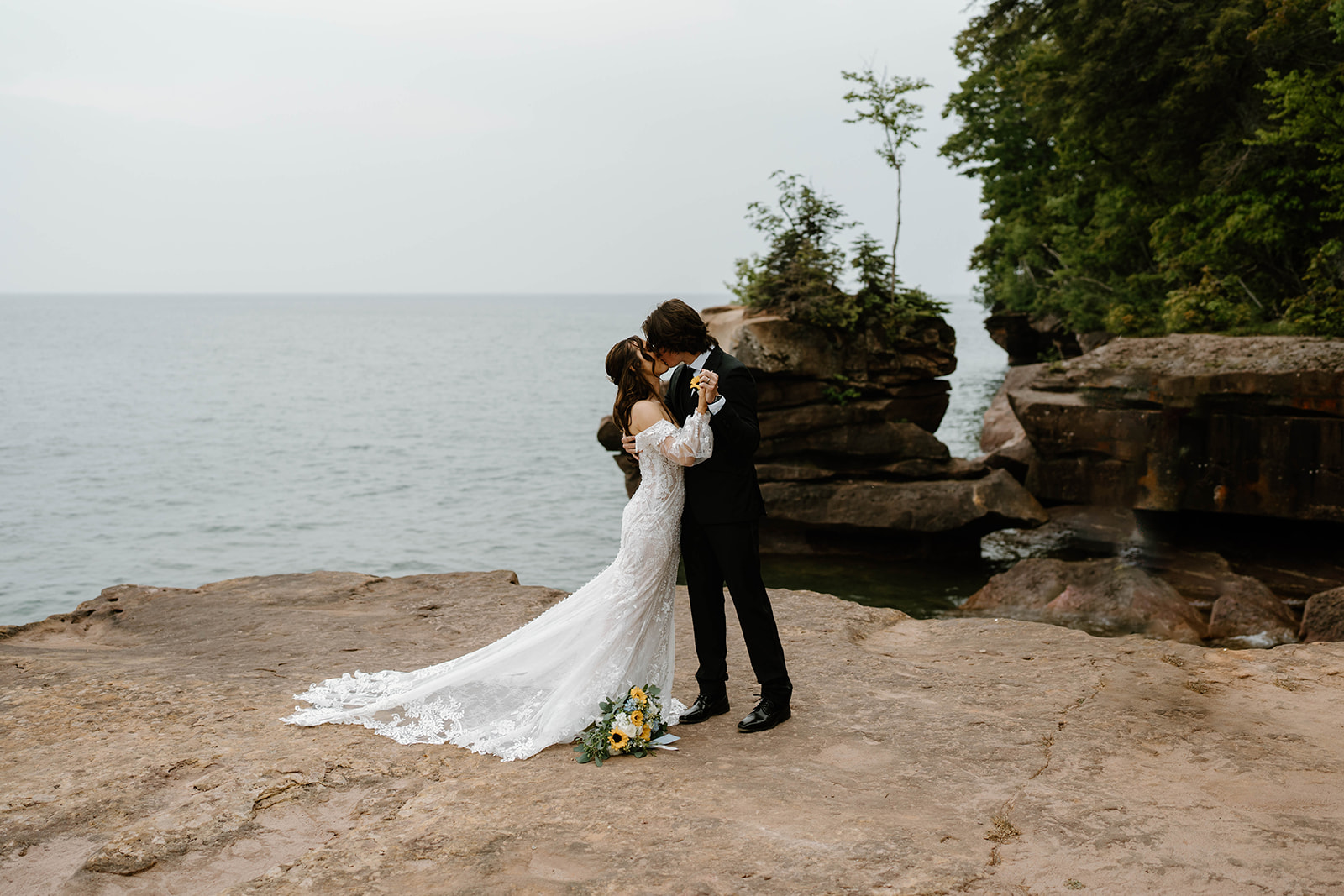 A couple who eloped on Madeline Island say their vows in front of Lake Superior