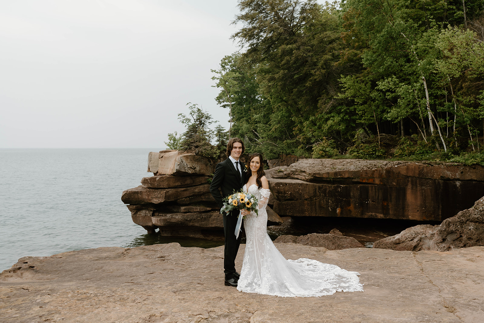 A couple who eloped on Madeline Island say their vows in front of Lake Superior