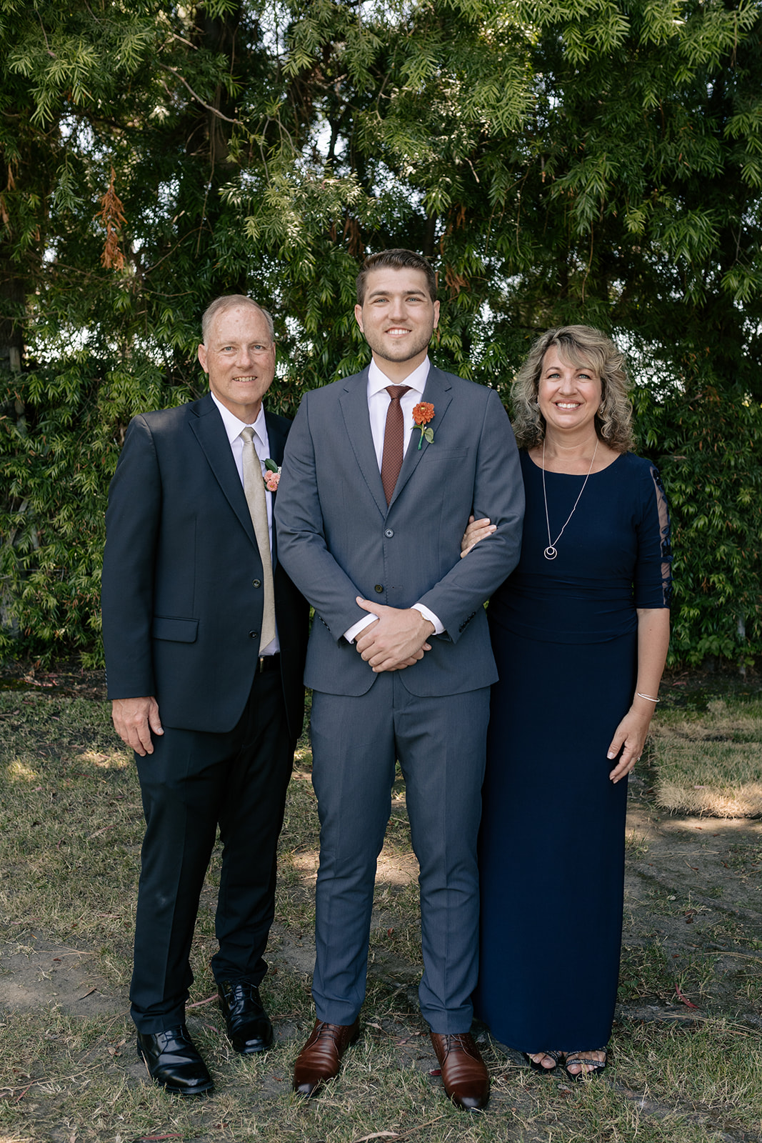 griffith house anaheim california socal orange county wedding groomsmen pictures navy blue suits groom red boutonnieres