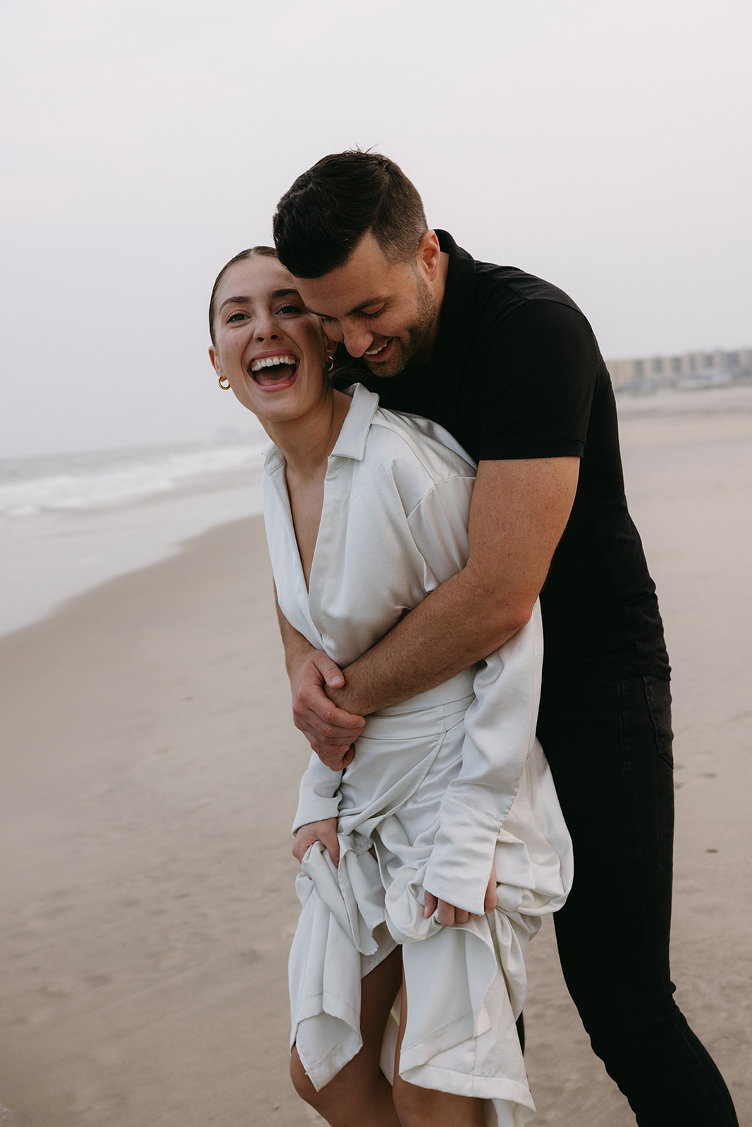 A romantic couple engagement session on a New Jersey beach