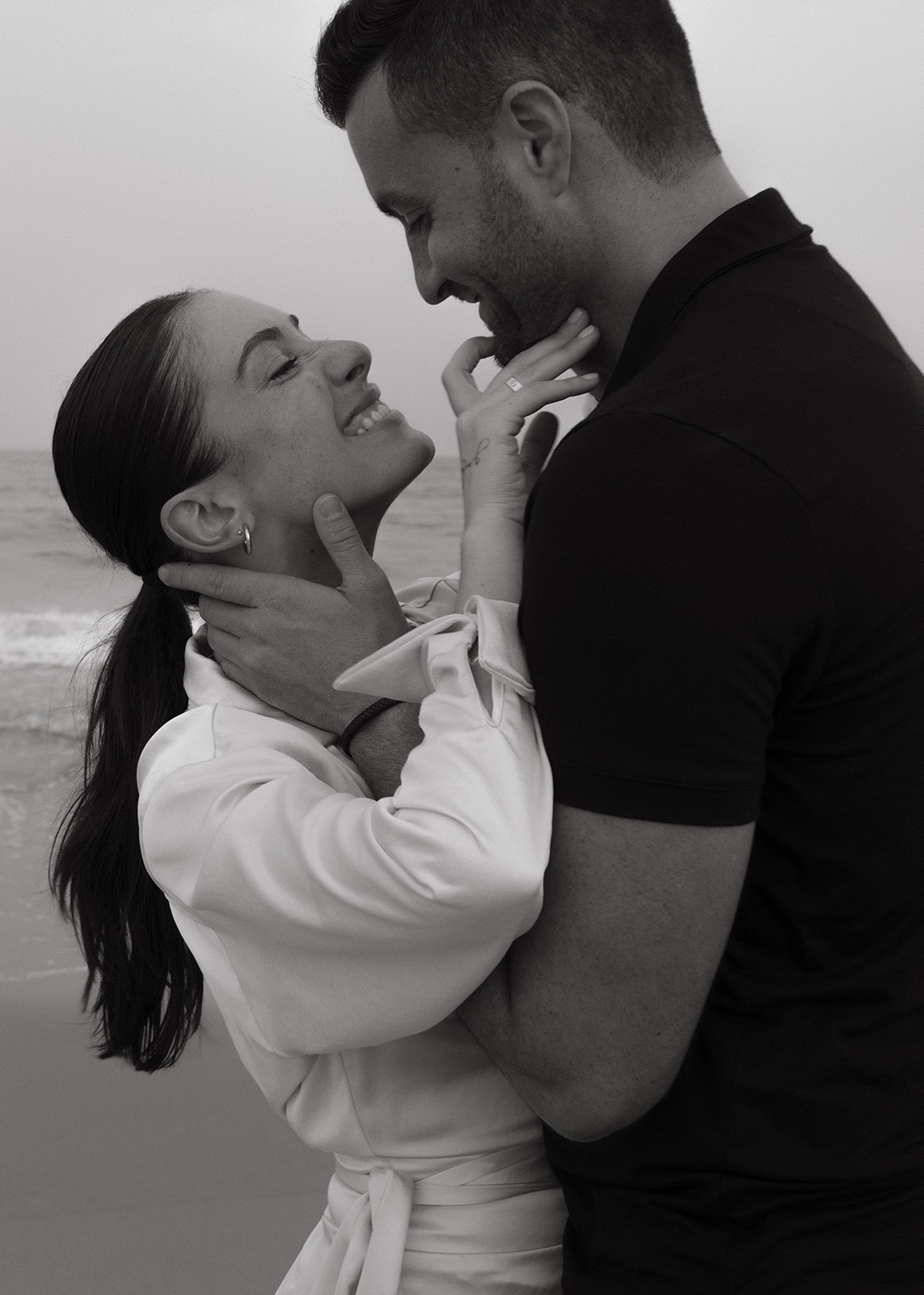 A romantic couple engagement session on a New Jersey beach