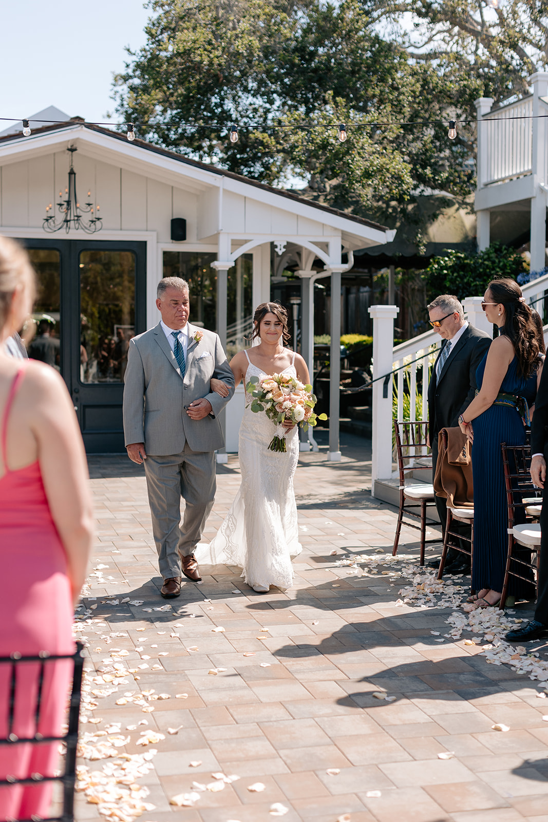 the perry house wedding monterey california outdoor ceremony gray wedding suit groom walking down aisle ceremony ideas