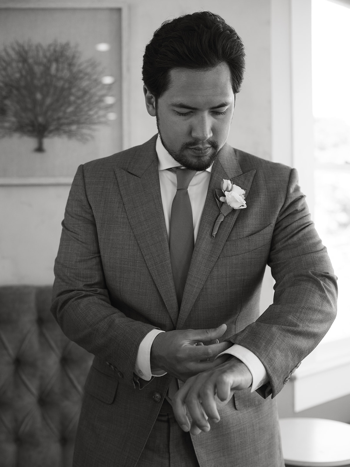 the perry house wedding monterey california groom getting ready pictures gray tux suit personalized socks b&w pictures