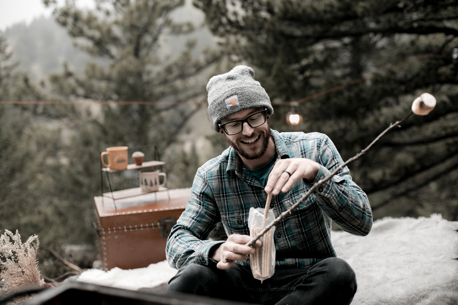 Roasting marshmallows while glamping in the Rocky Mountains