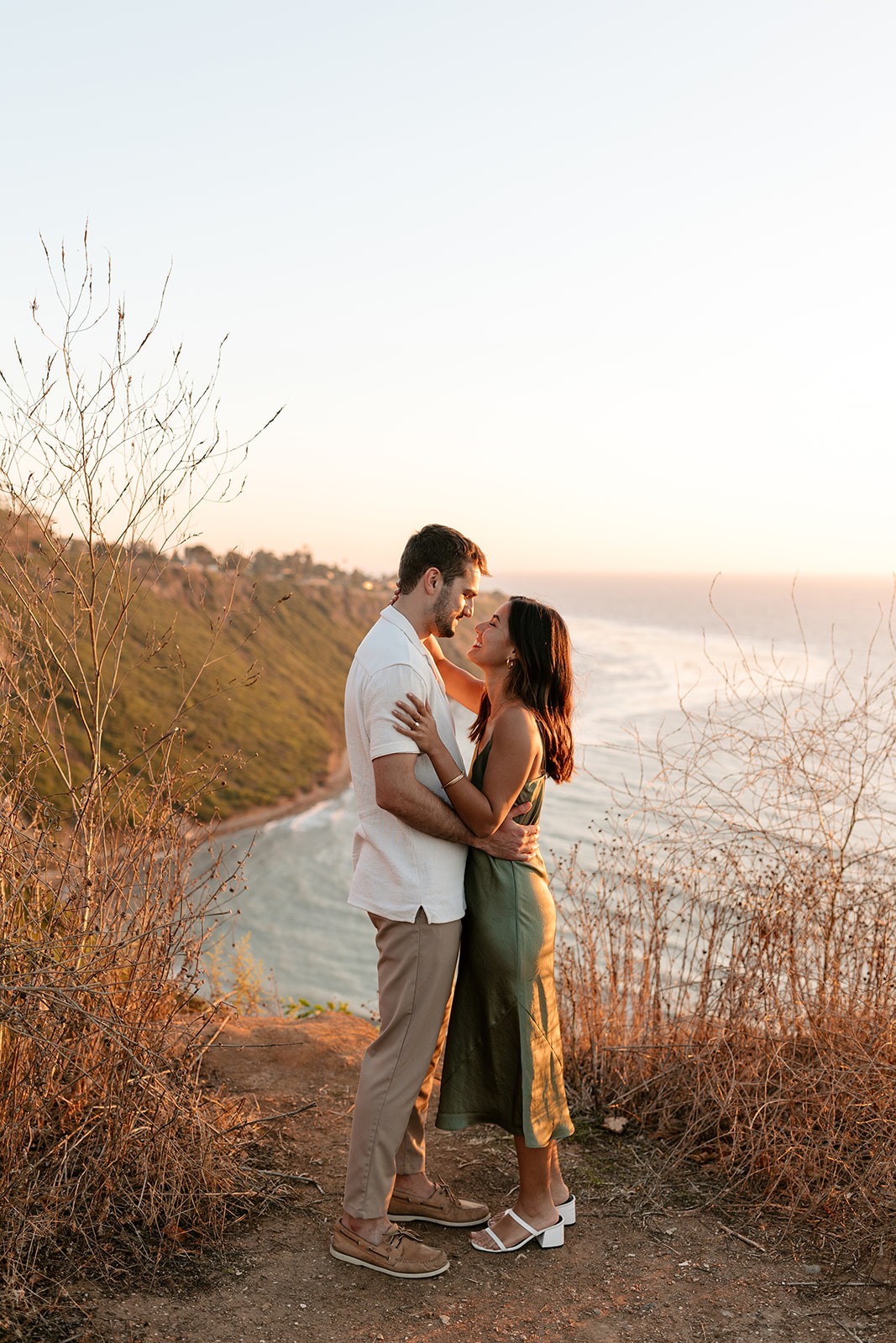 cliffside proposal engagement session palos verdes california socal couples hugging poses foot pop princess foot pop