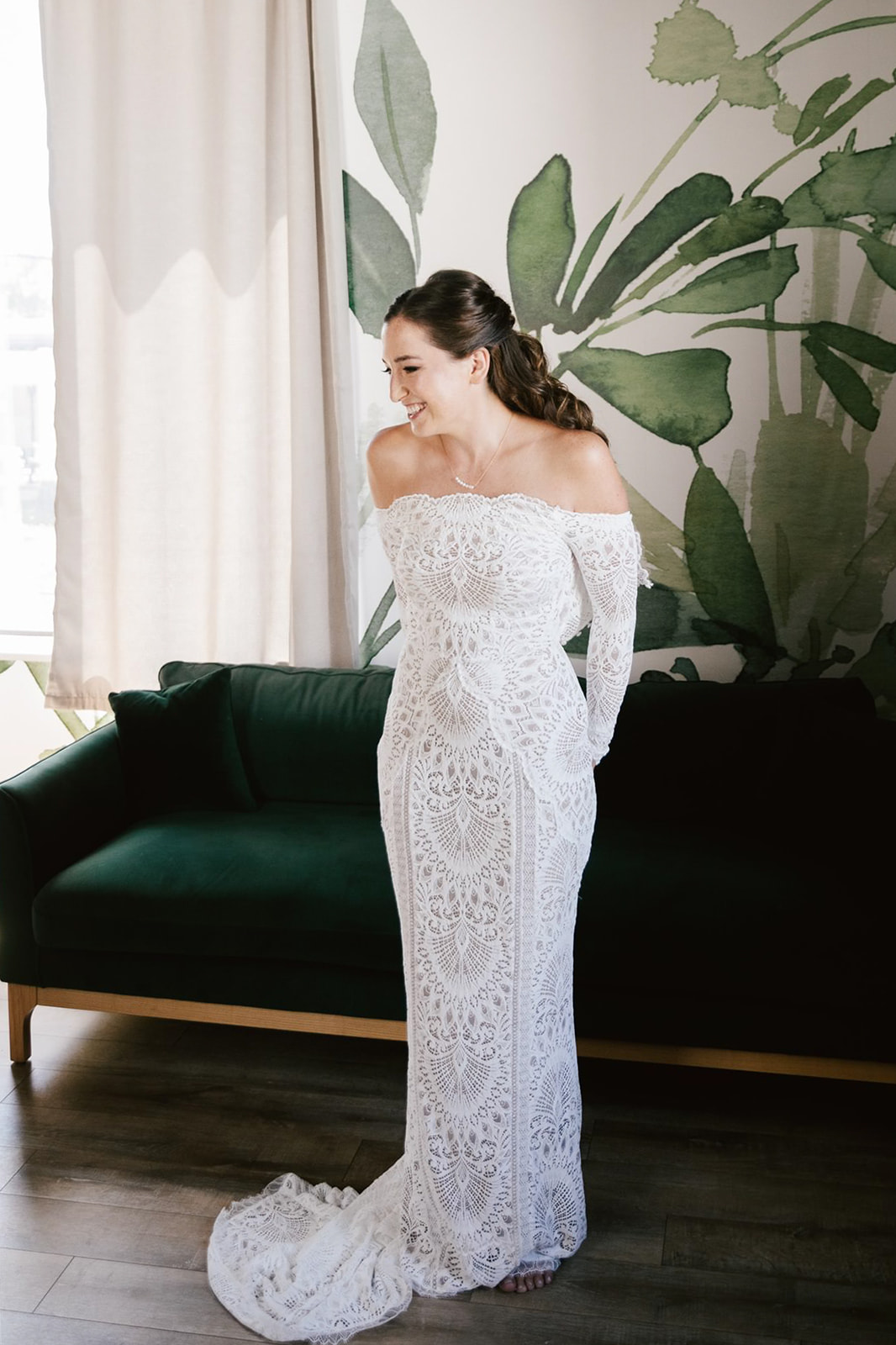 Bride's preparation unfolds in the lush, greenery-adorned room at Walden Chicago, capturing moments of anticipation. 
