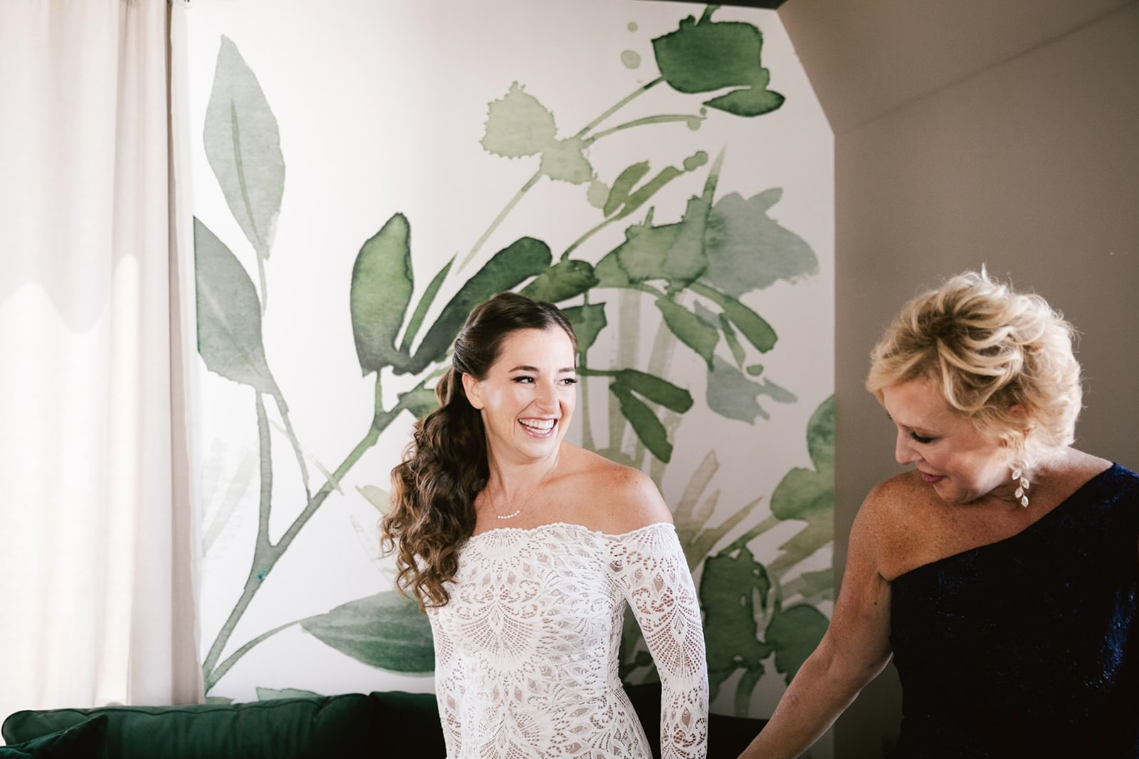Bride's preparation unfolds in the lush, greenery-adorned room at Walden Chicago, capturing moments of anticipation. 