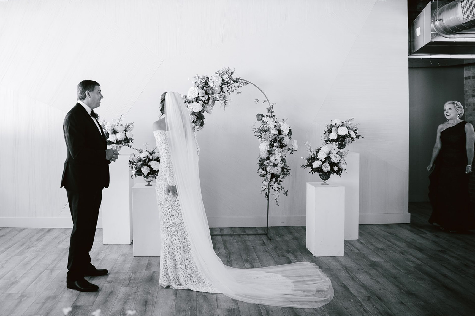 Capturing an emotional moment: The bride shares a heartfelt first look with her parents at Walden Chicago, capturing the
