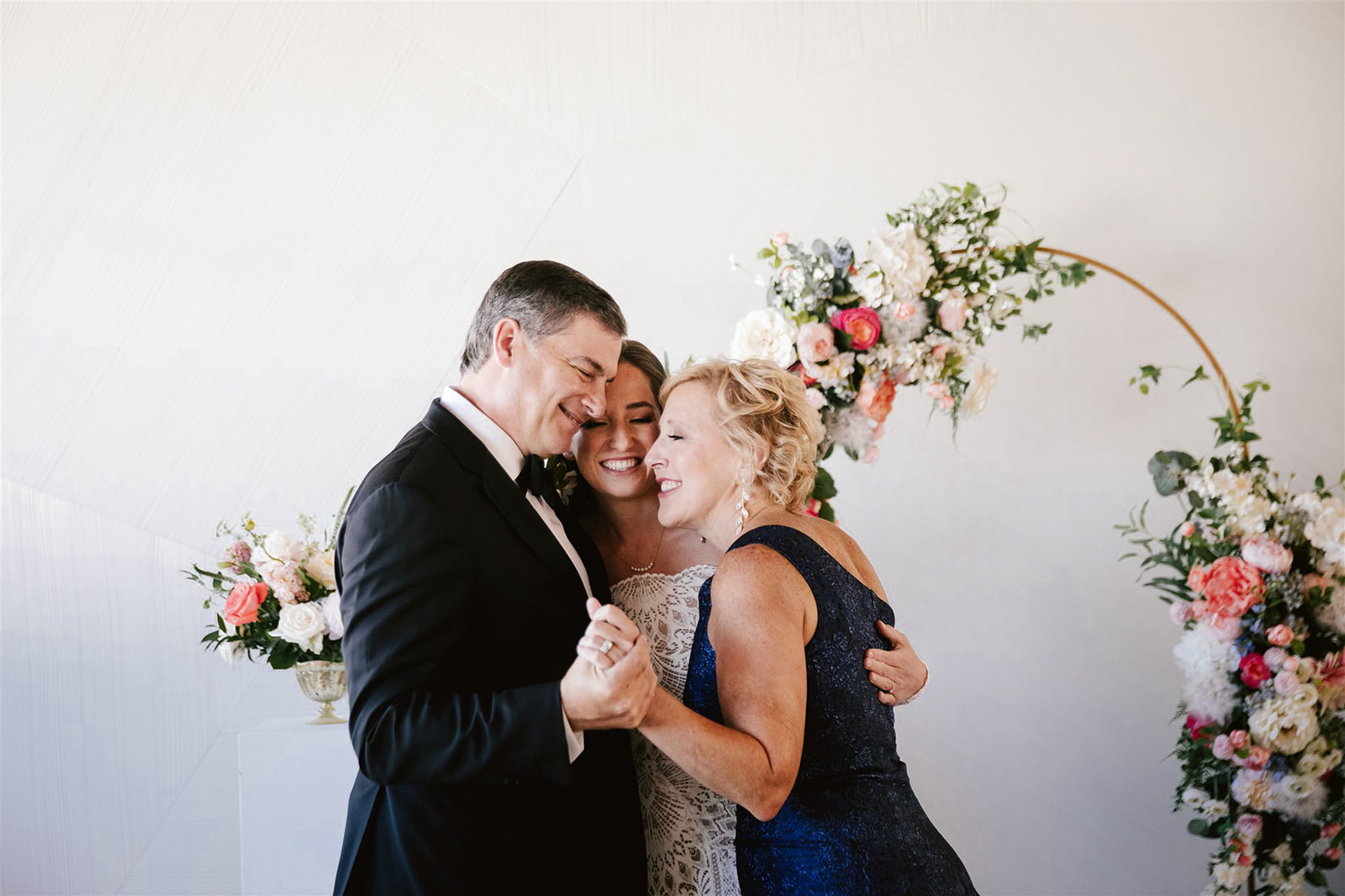 Capturing an emotional moment: The bride shares a heartfelt first look with her parents at Walden Chicago, capturing the