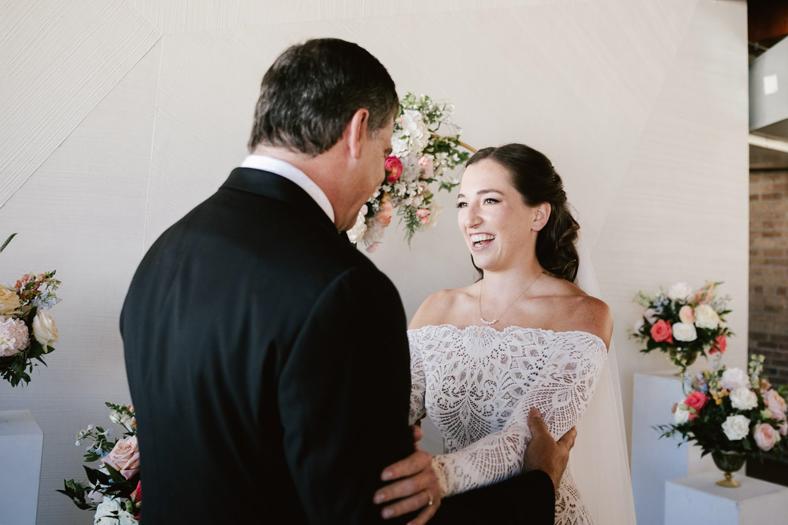 he emotional first look: Bride shares a heartfelt moment with her father at Walden Chicago before the ceremony.
