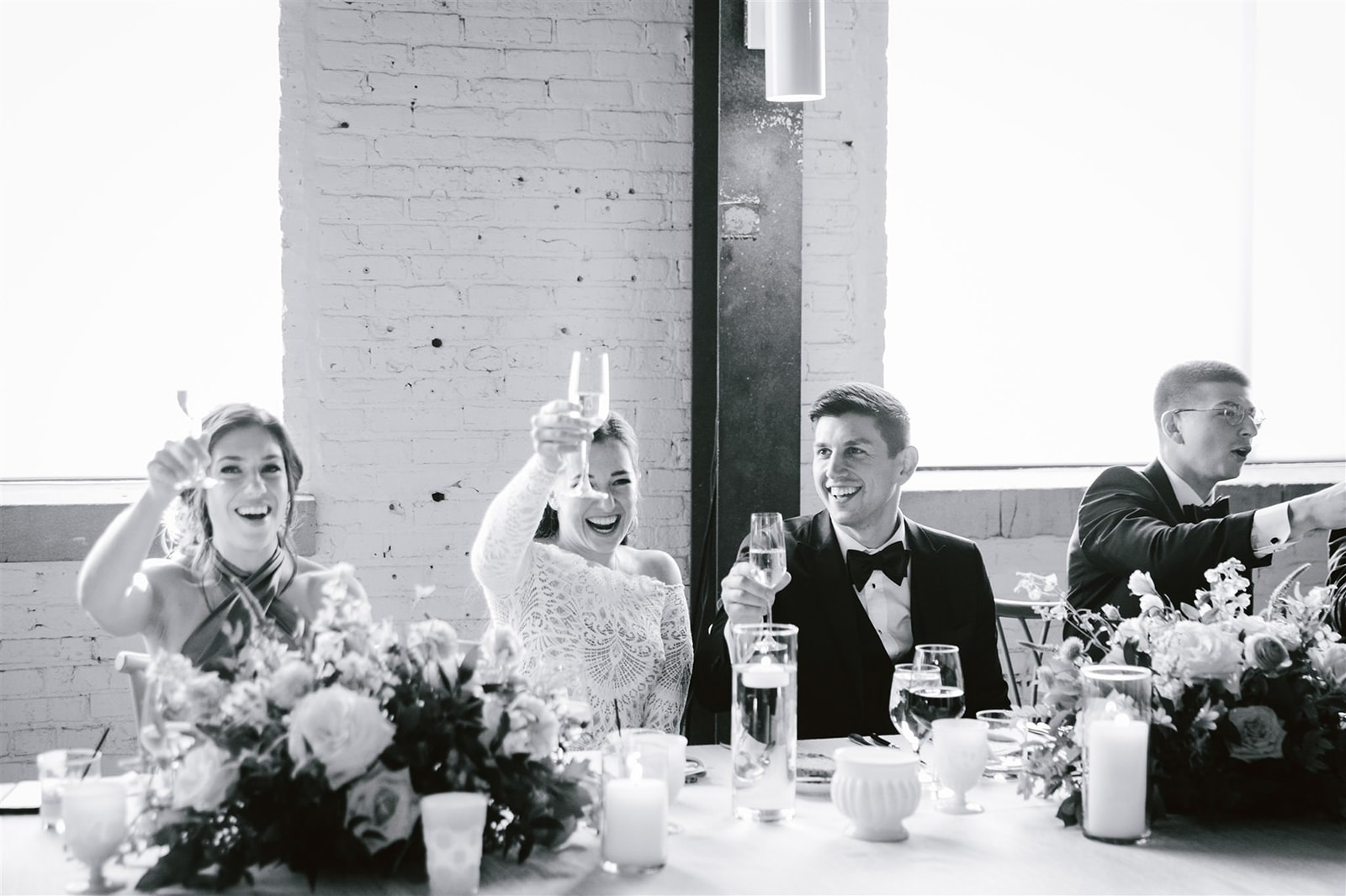 The bride and groom are joyfully toasted during their reception at Walden Chicago.