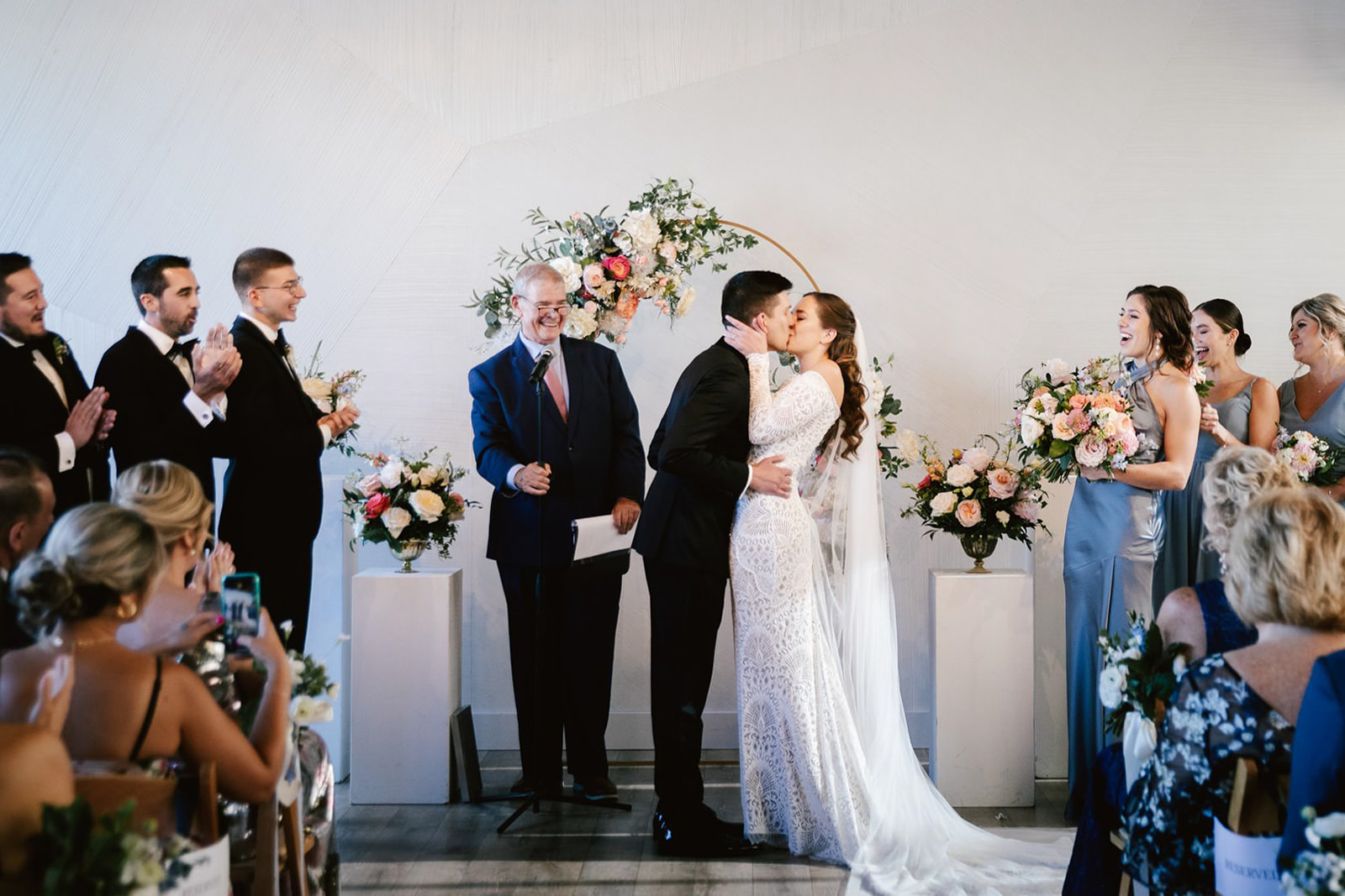 The magical first kiss: The bride and groom seal their love with a tender embrace, captured in a timeless moment at Wald