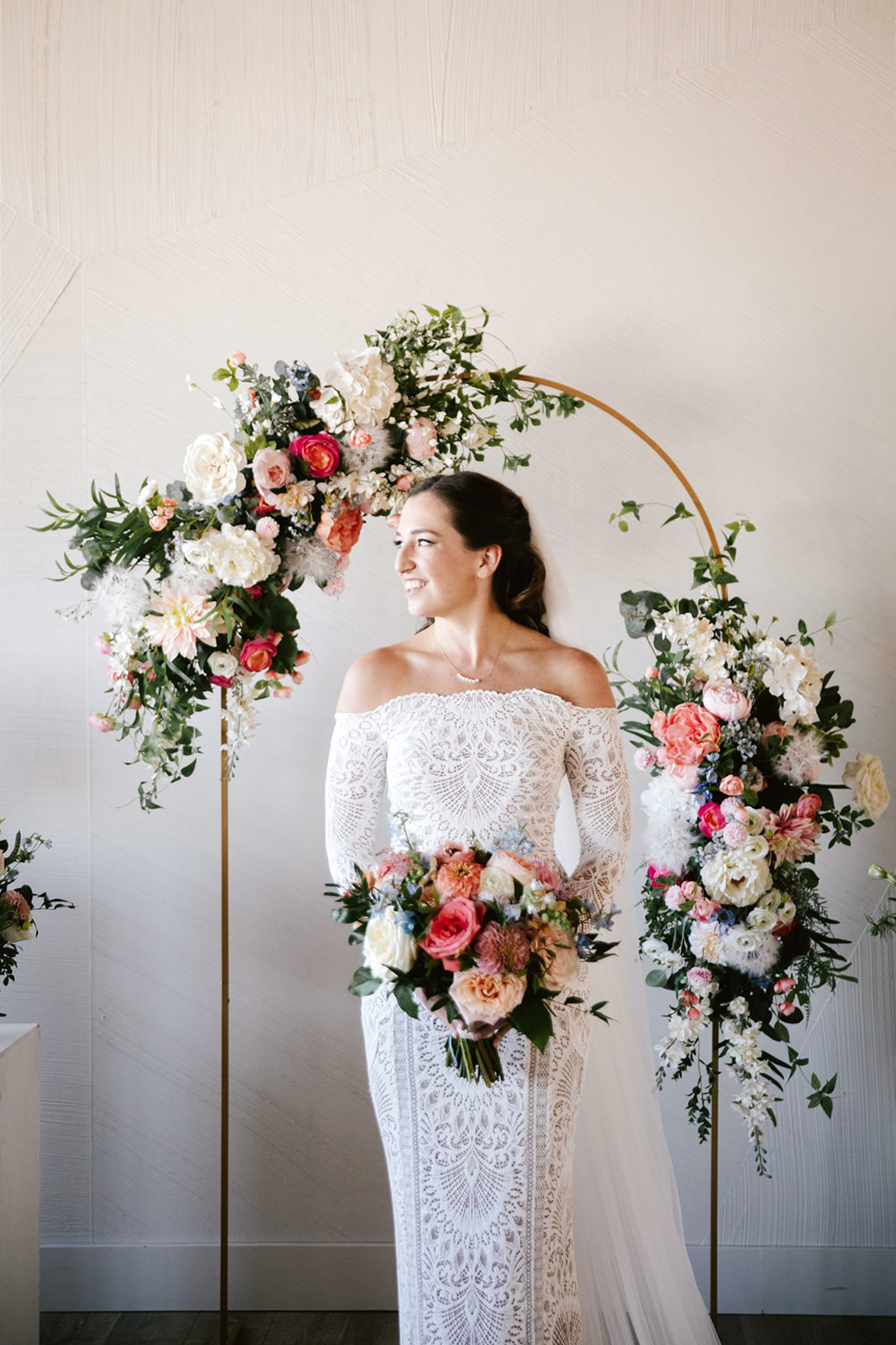 At Walden Chicago, the bride first look amidst vibrant peach, coral, and white blooms.
