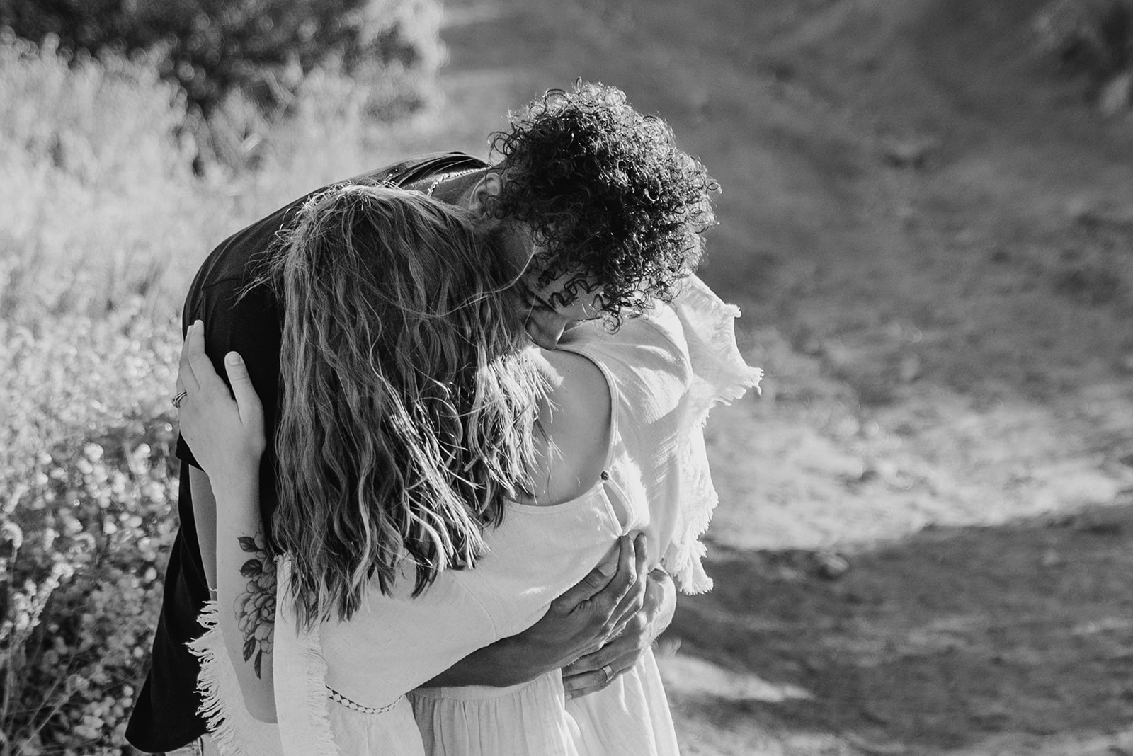 Couple nuzzles in together during Palm Springs engagement session