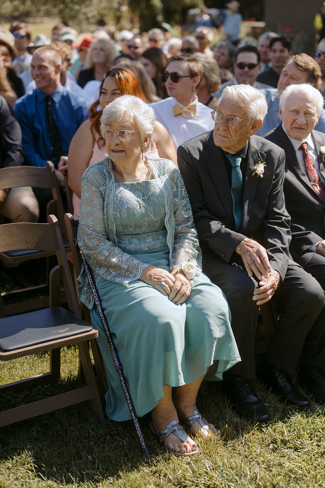 Grandparents watching bride walk down the aisle at La Arboleda in California 