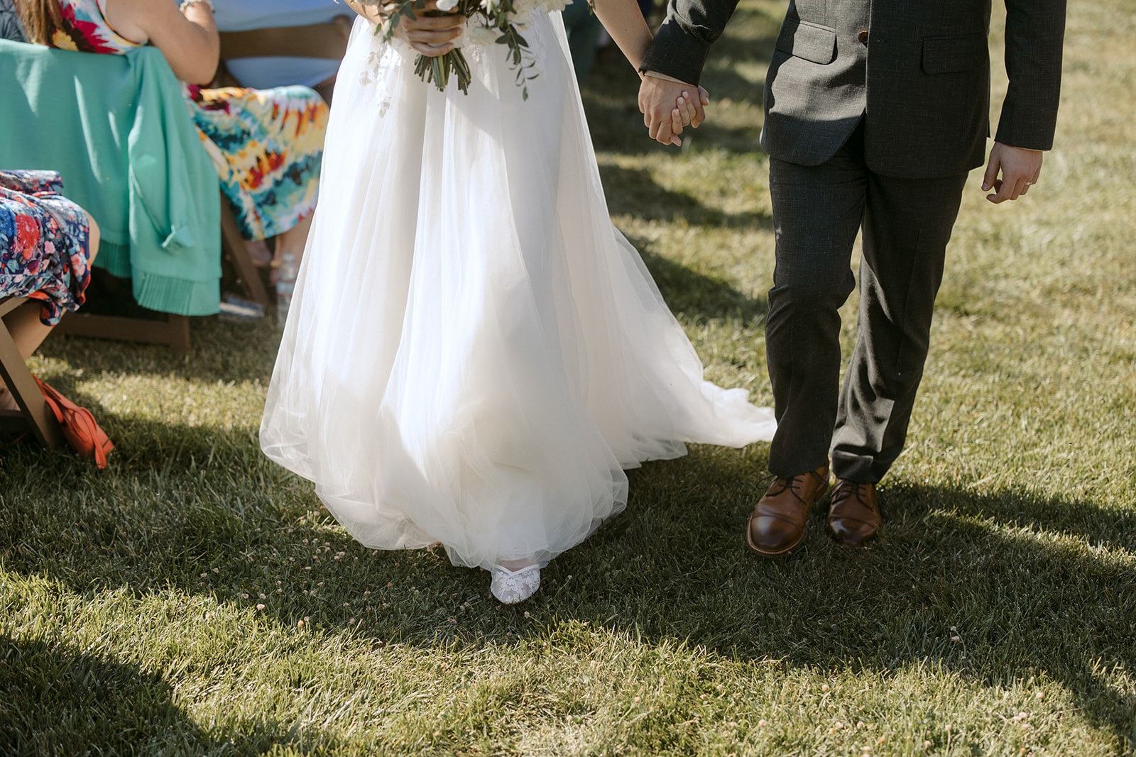 Bride and groom walking down the aisle after wedding ceremony at La Arboleda in California 