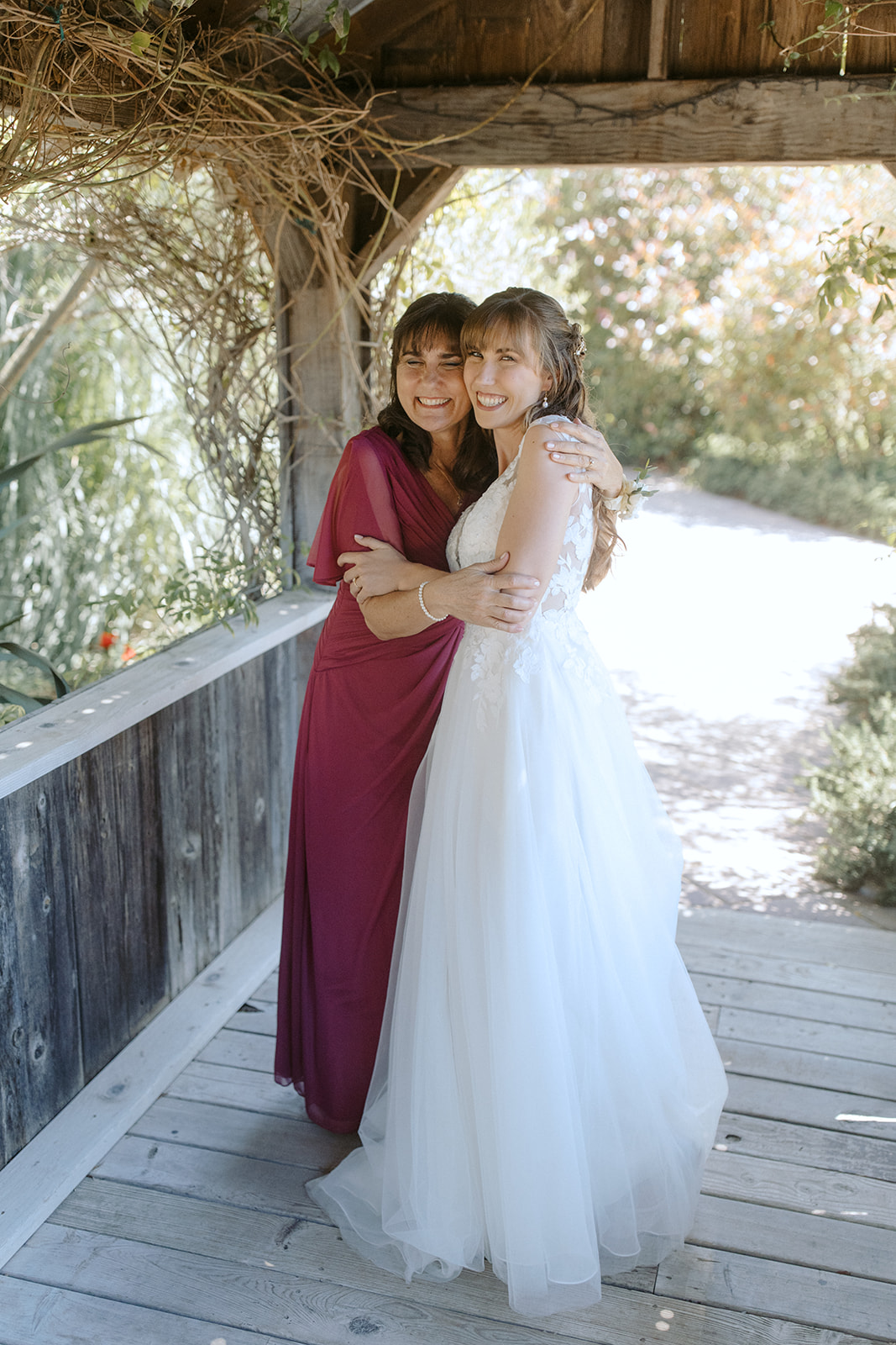 Bride getting ready with her mom at La Arboleda in California
