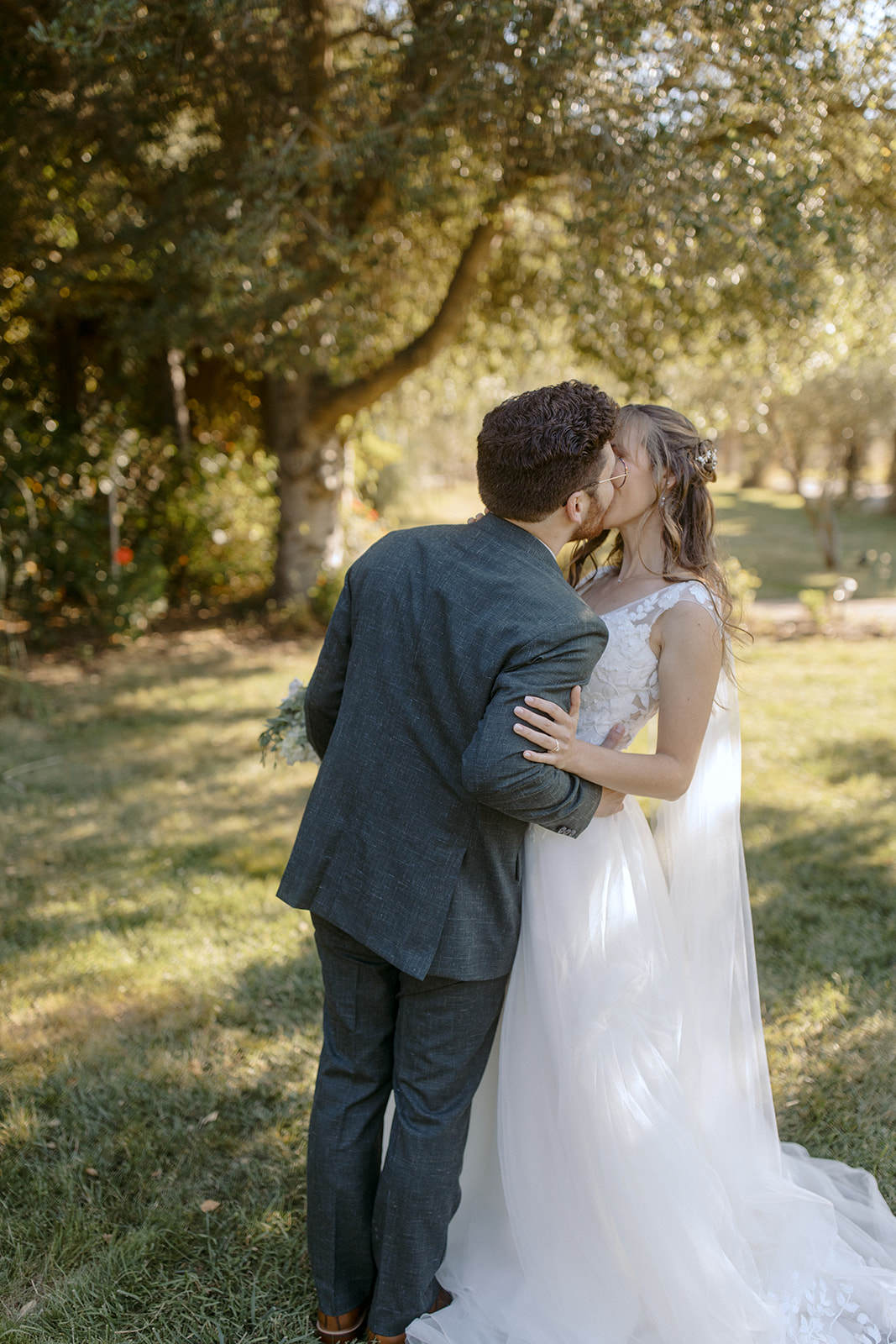 Bride and groom kiss at La Arboleda in California