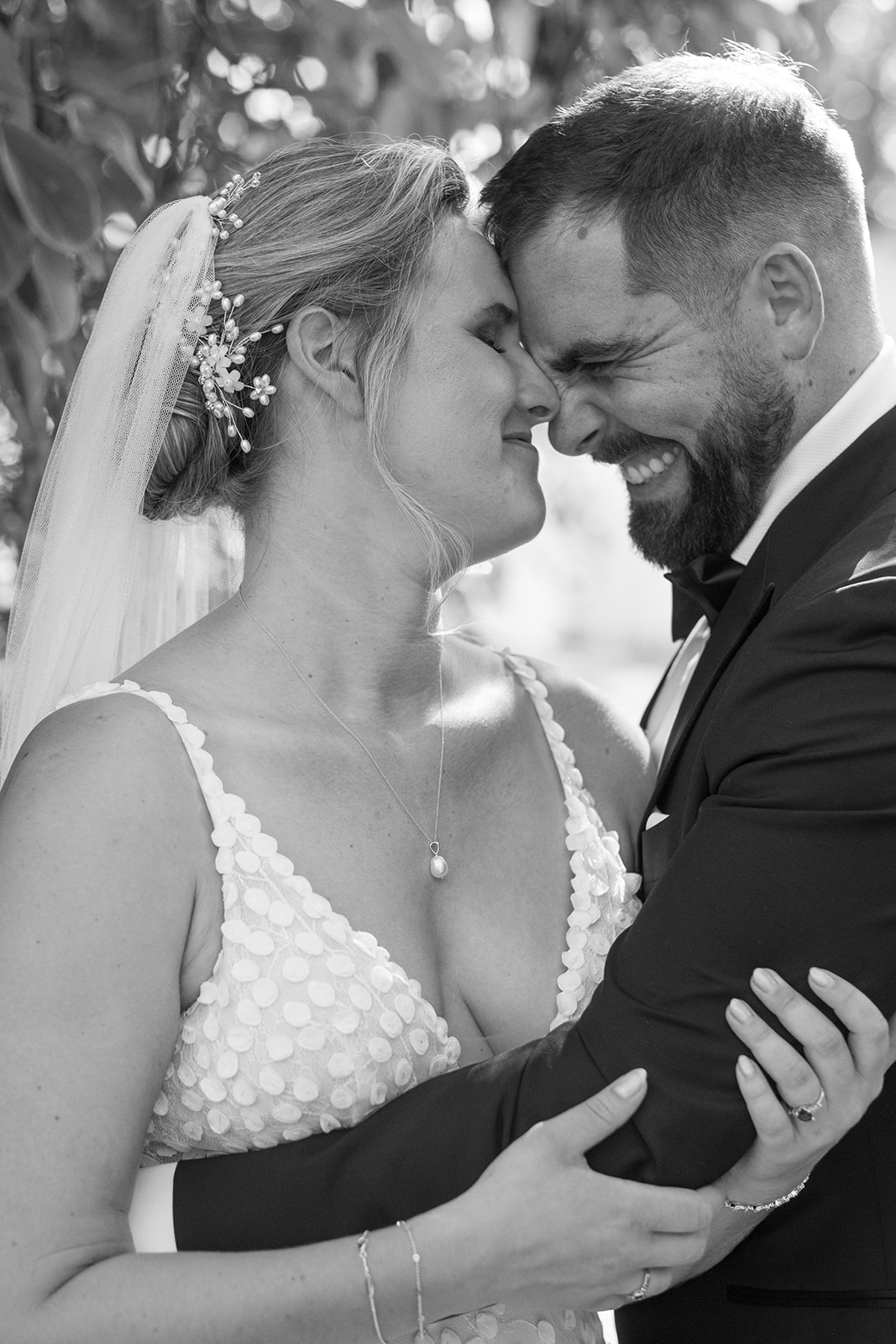 Bride and groom embrace with laughter at Loudoun County wedding