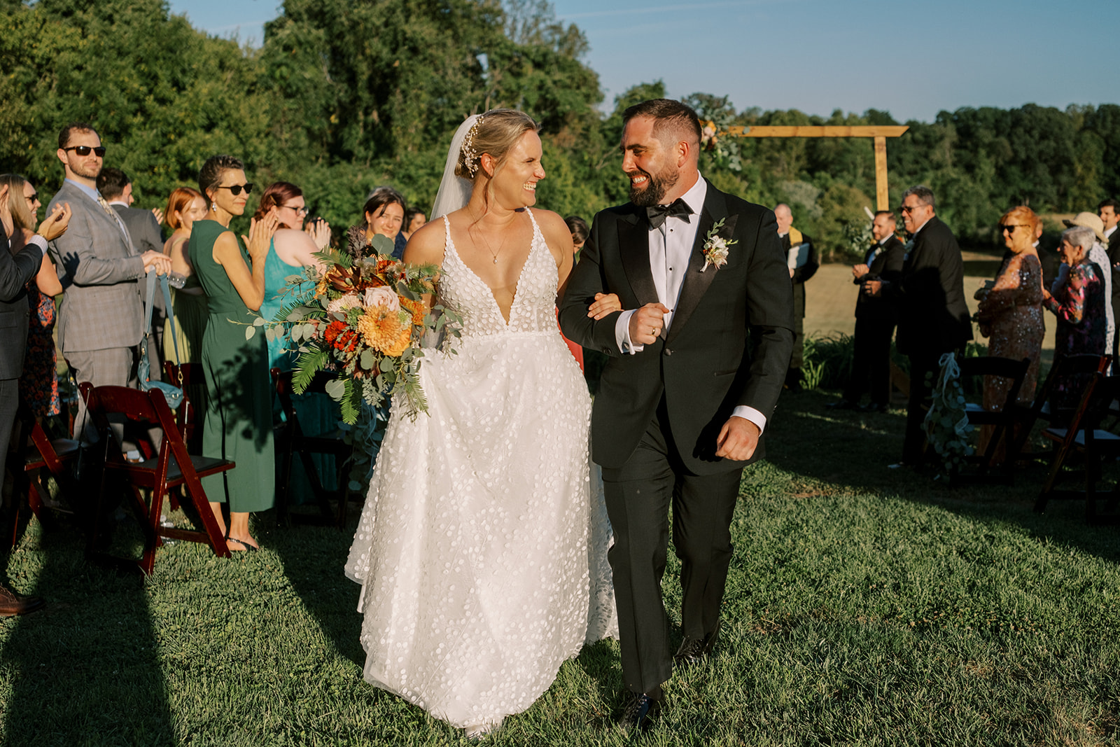 bride and groom walk up the aisle during Virginia farm wedding recessional