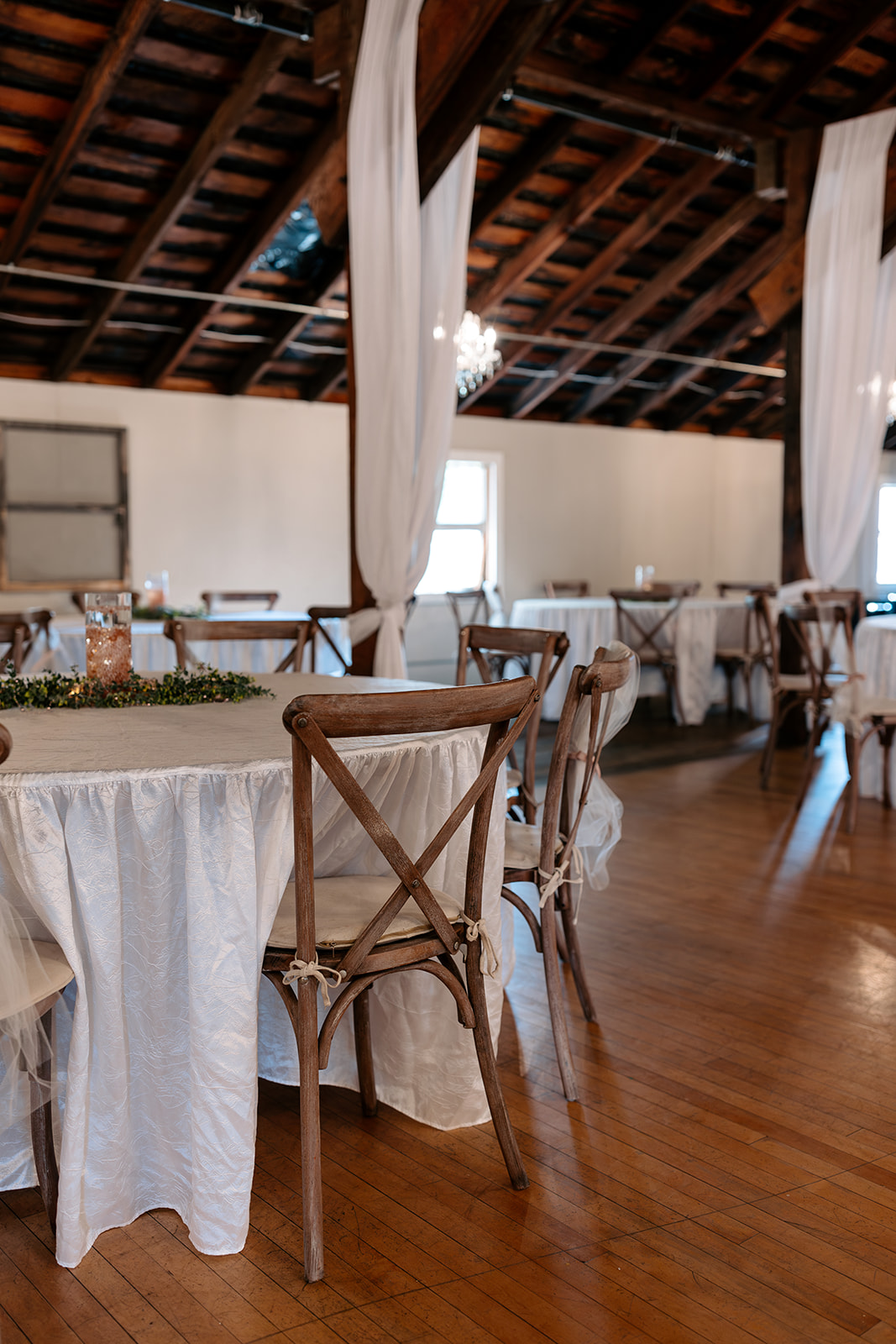 copper gables barn wedding roy washington state indoor wedding venue reception ceremony wooden wedding chairs 
