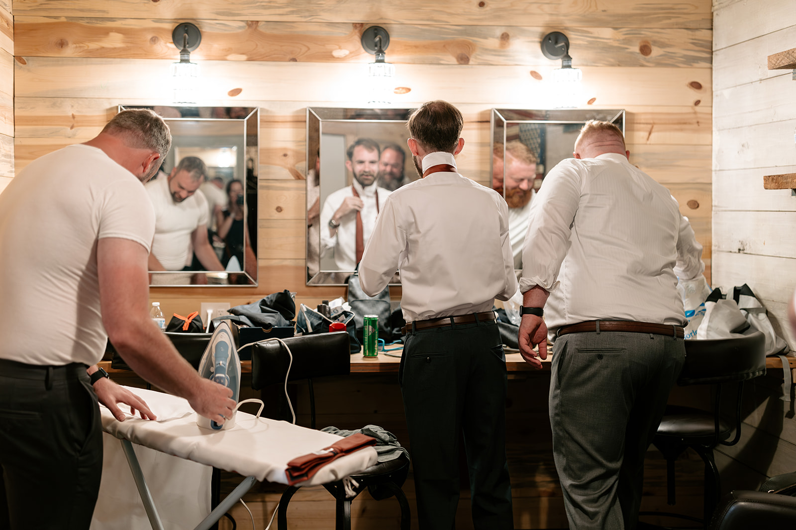 copper gables barn wedding roy washington state groom getting ready pictures white button up dark gray wedding vest