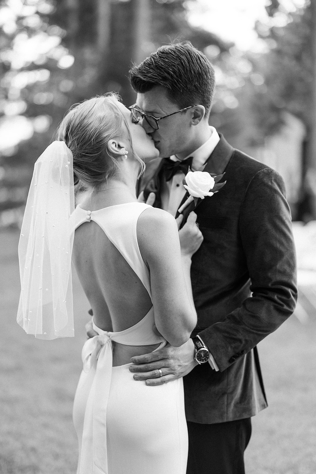 bride and groom embrace during their wedding day portraits at chippewa retreat resort