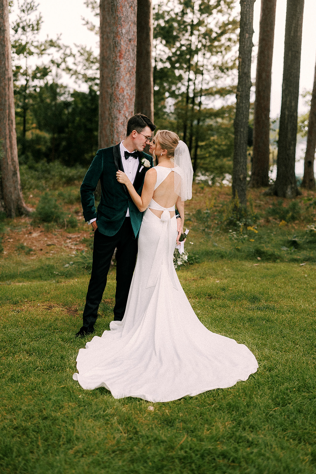 bride and groom kiss during their wedding day portraits at chippewa retreat resort
