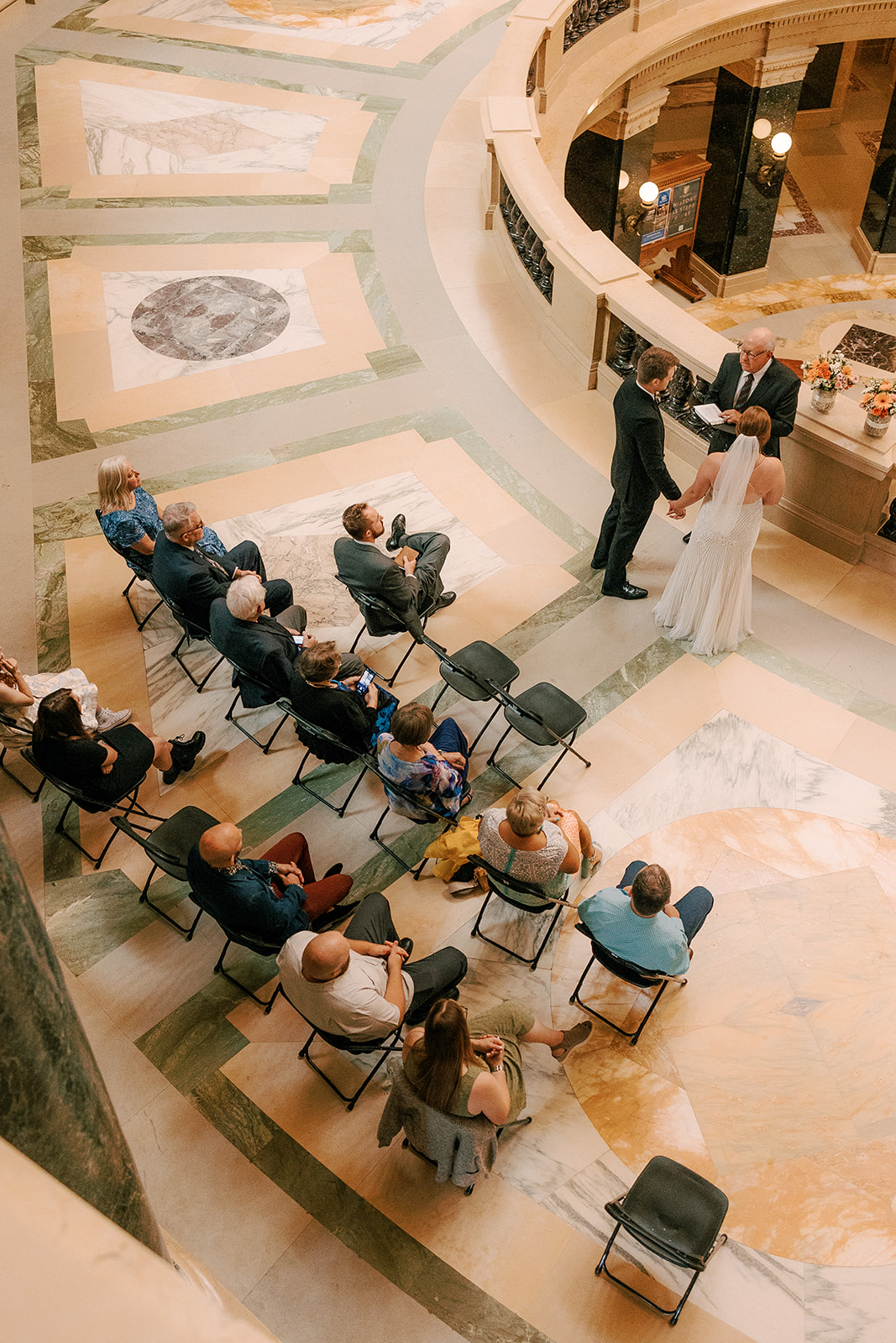 bride and groom have intimate ceremony on their elopement day at the wisconsin state capitol