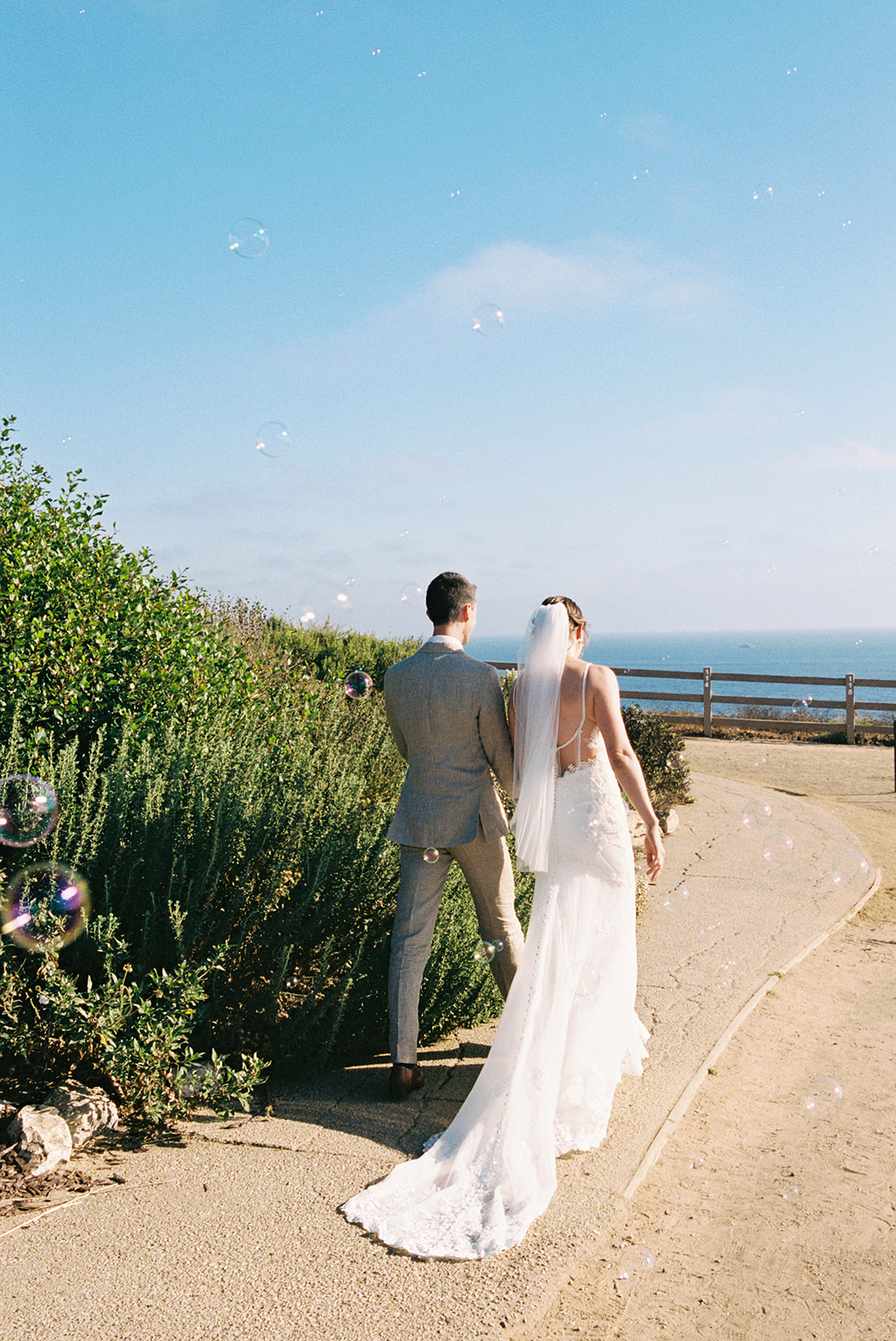 point vicente lighthouse wedding rancho palos verdes california bride and groom newly wed portraits bubbles film photos