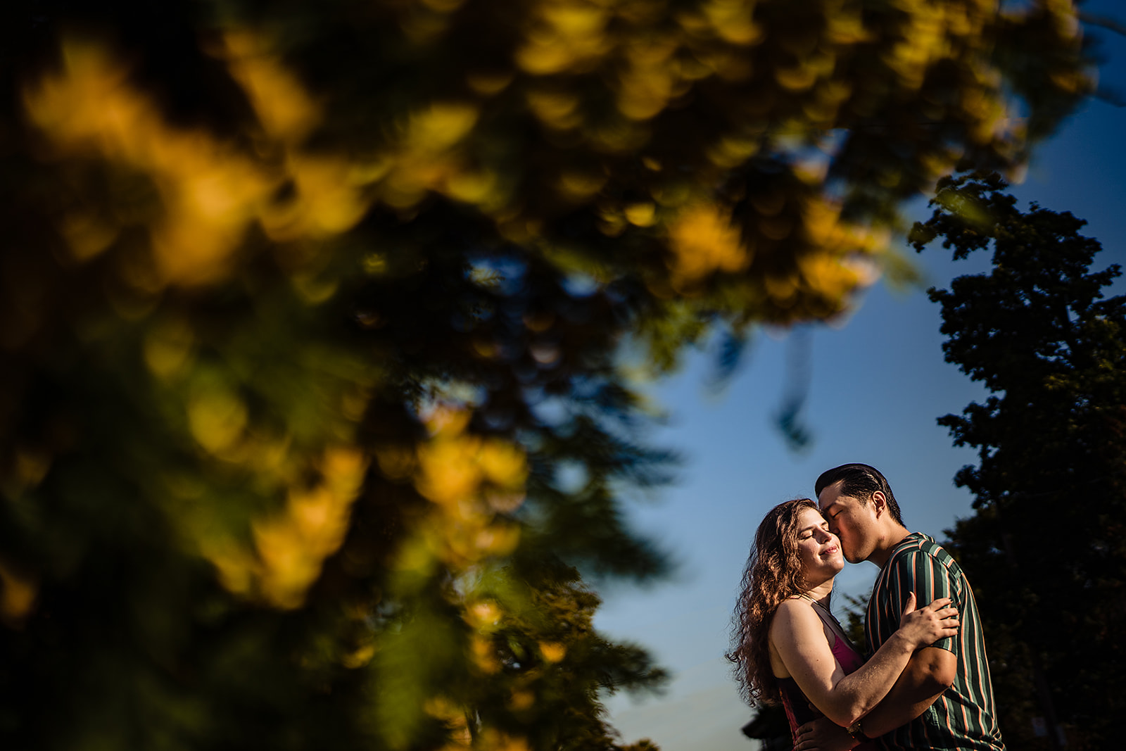 Couple kissing on their engagement session 